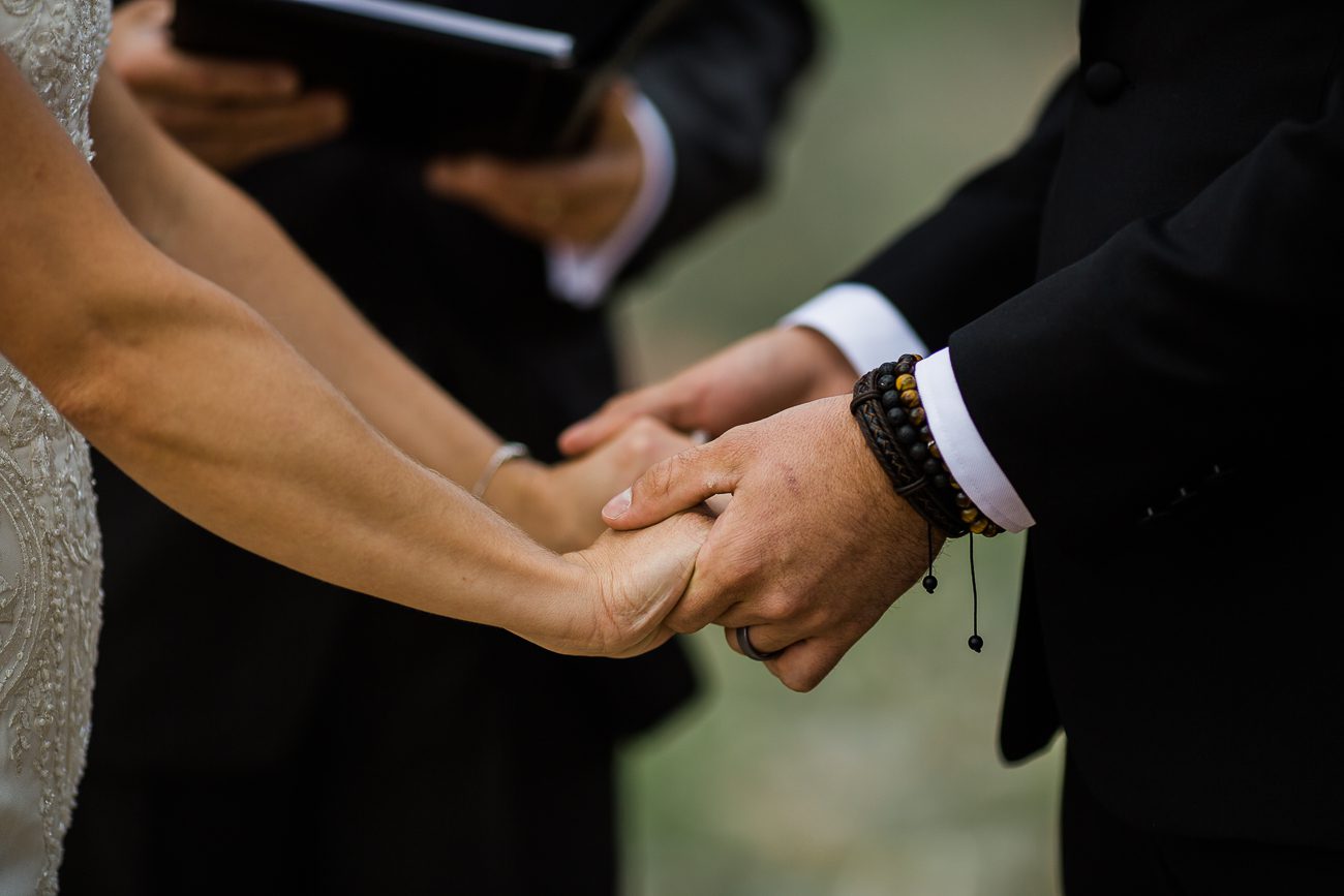 holding hands during wedding