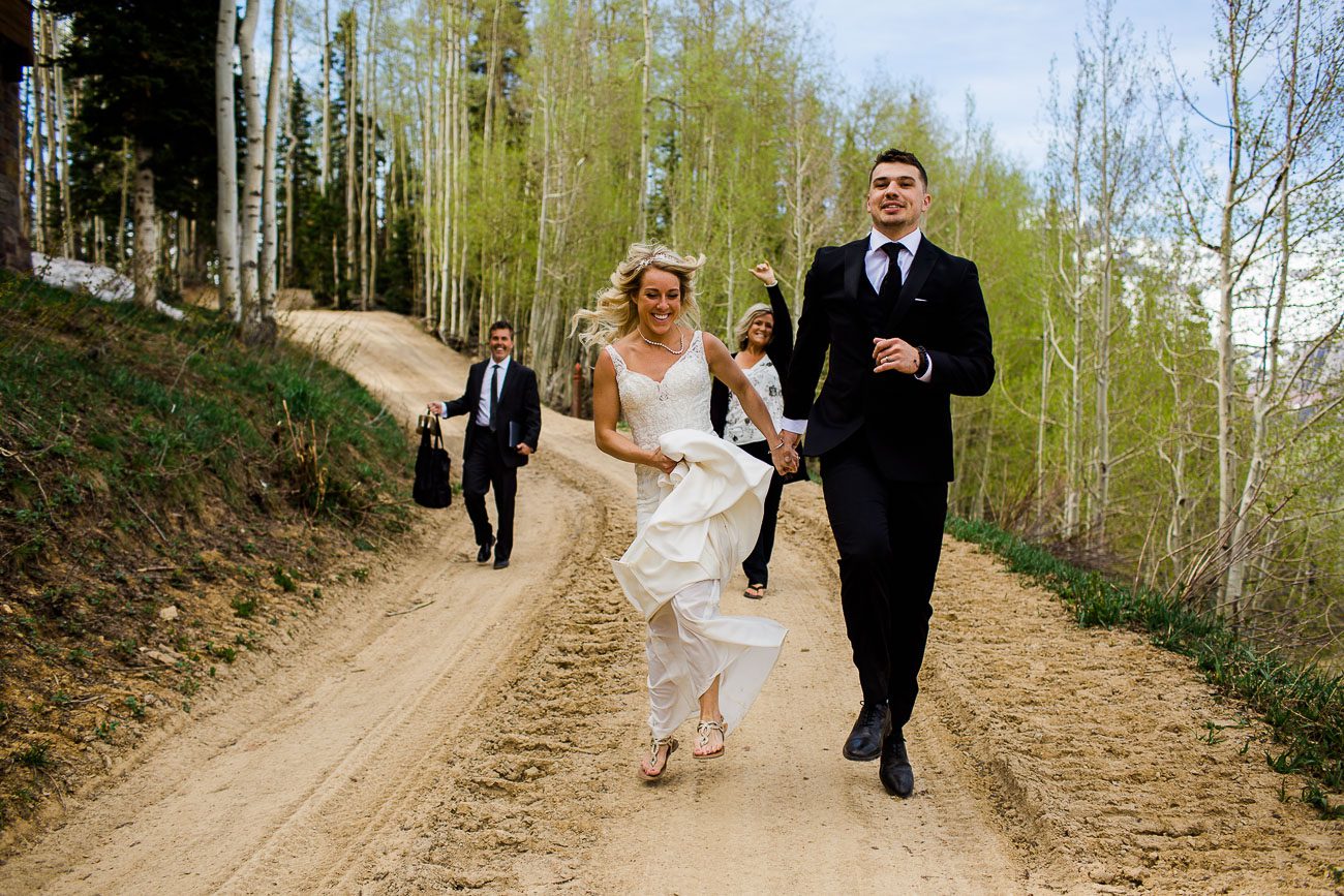 Bride and groom skipping on wedding day