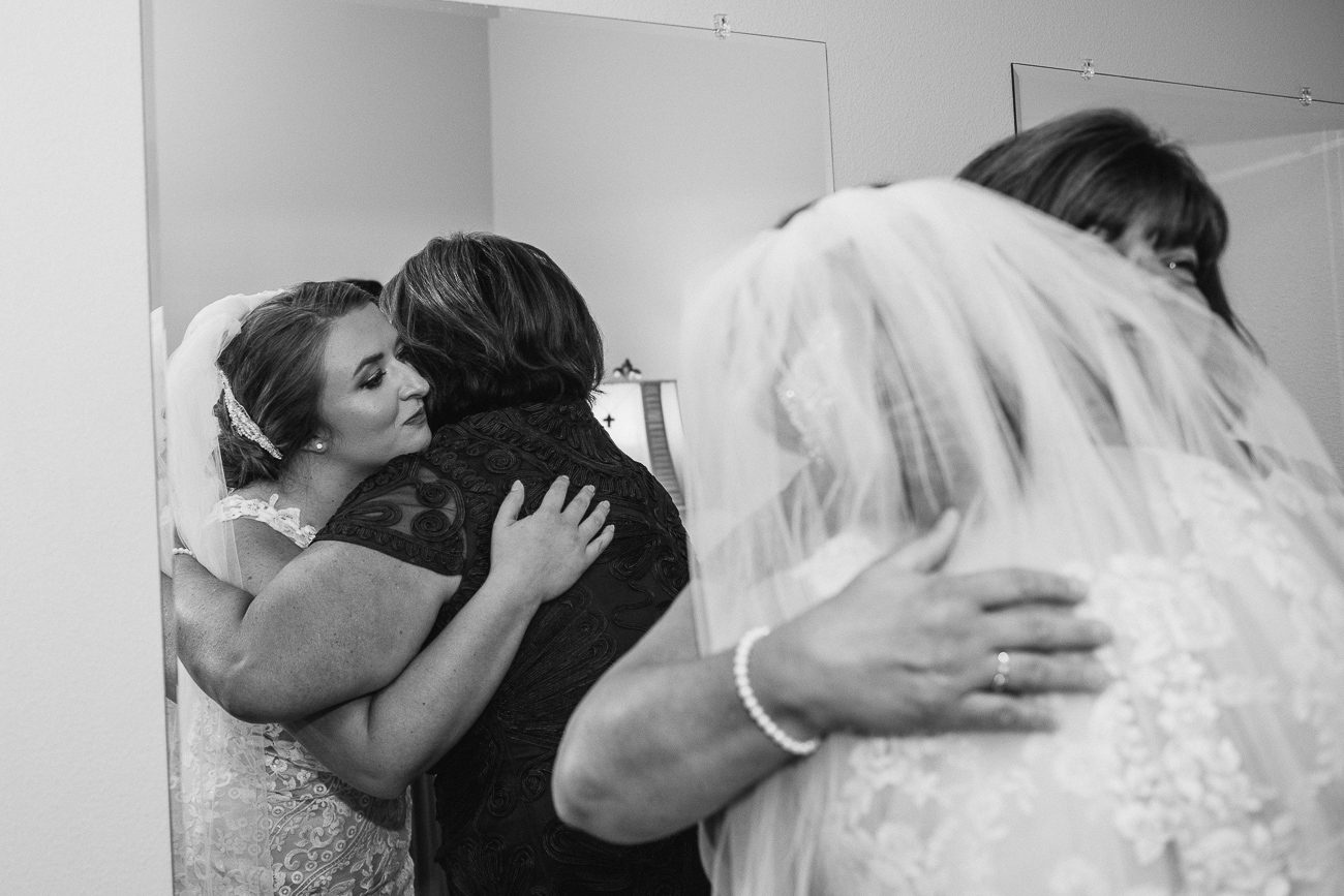 Mom and Bride hugging