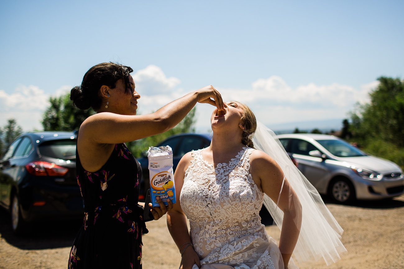 Bride eating goldfish on wedding day