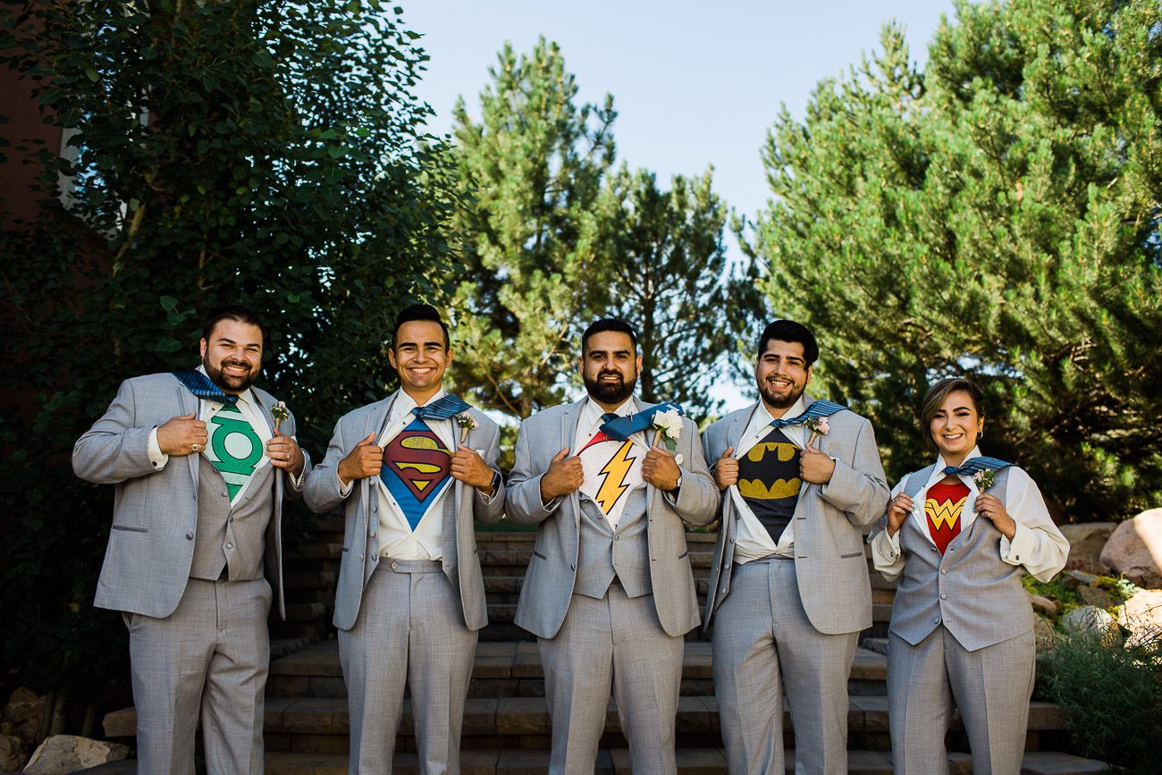 Creative groomsmen photo with superhero shirts