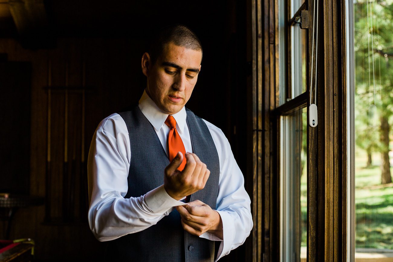 Groom getting ready Spruce Mountain Ranch