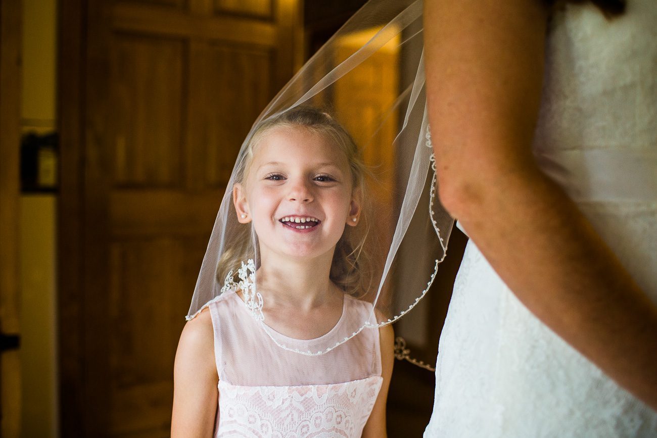 Flower girl in bride's veil picture