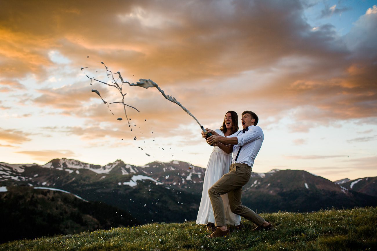 Popping champagne during elopement