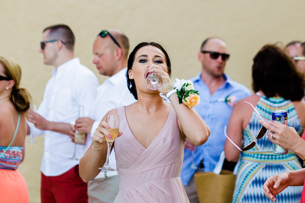 Bridesmaid drinking champagne