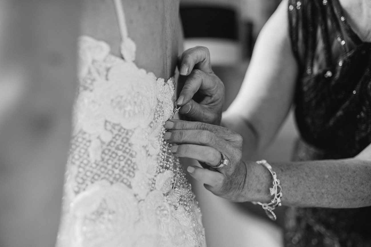 Zipping up wedding dress