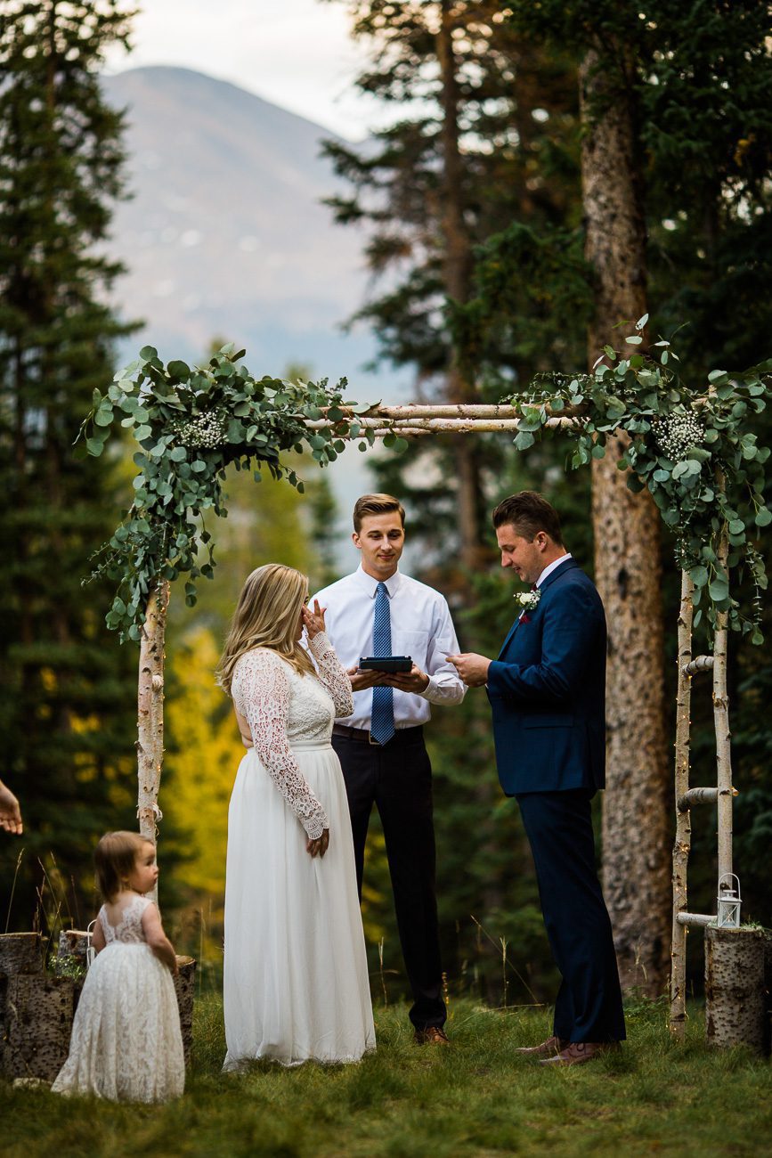 Exchanging vows backyard wedding