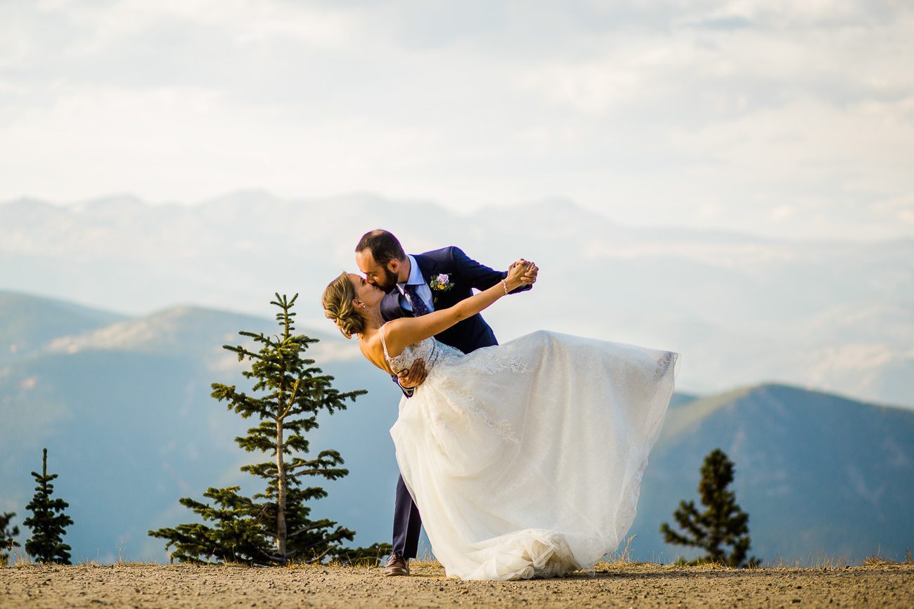 Picture of bride and groom dancing in the mountains