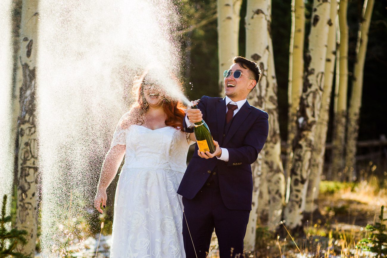 Popping champagne at wedding