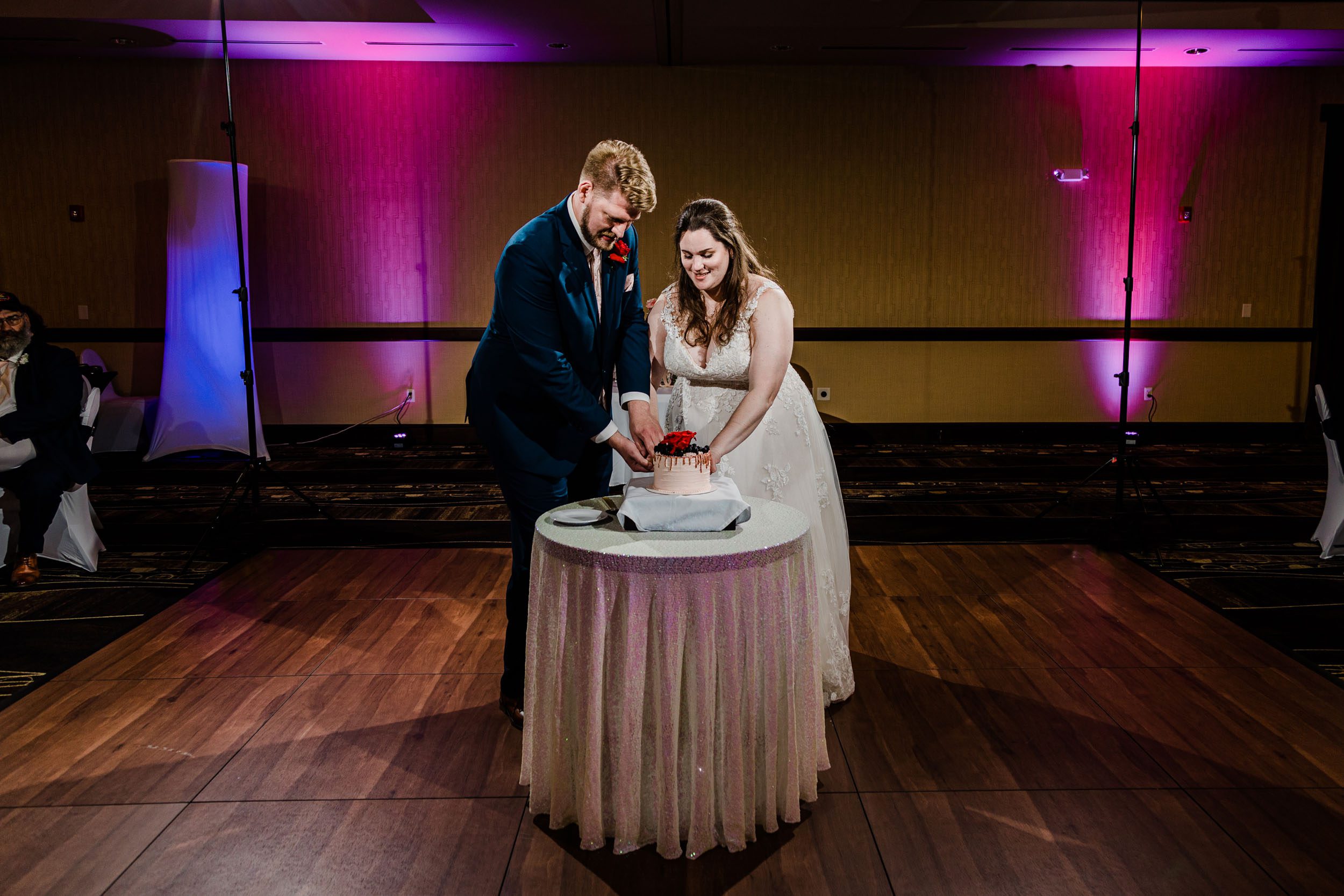 Cake cutting ballroom wedding