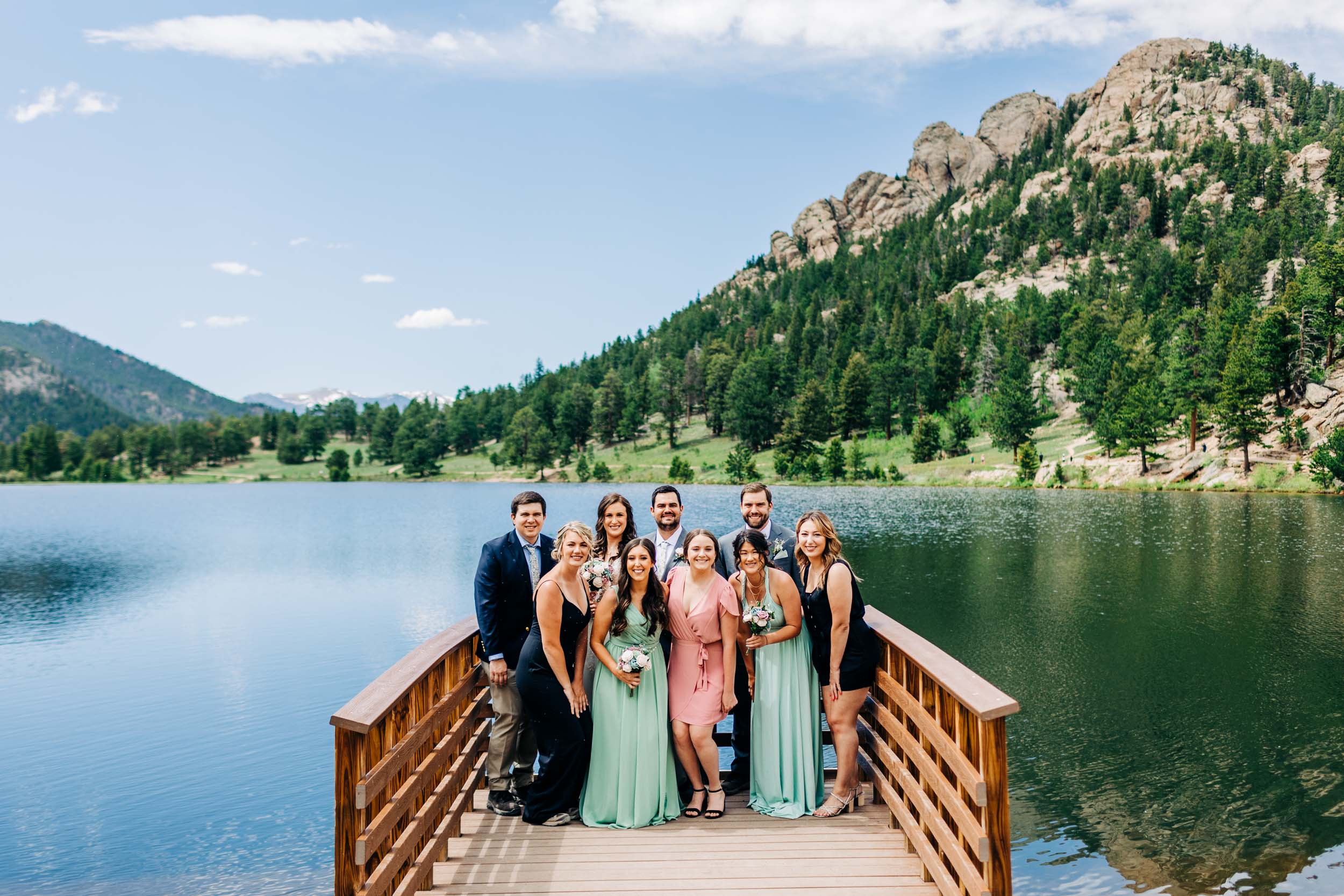 wedding party standing on dock at Lily Lake by Shea McGrath Photography Denver Colorado Wedding Photographer