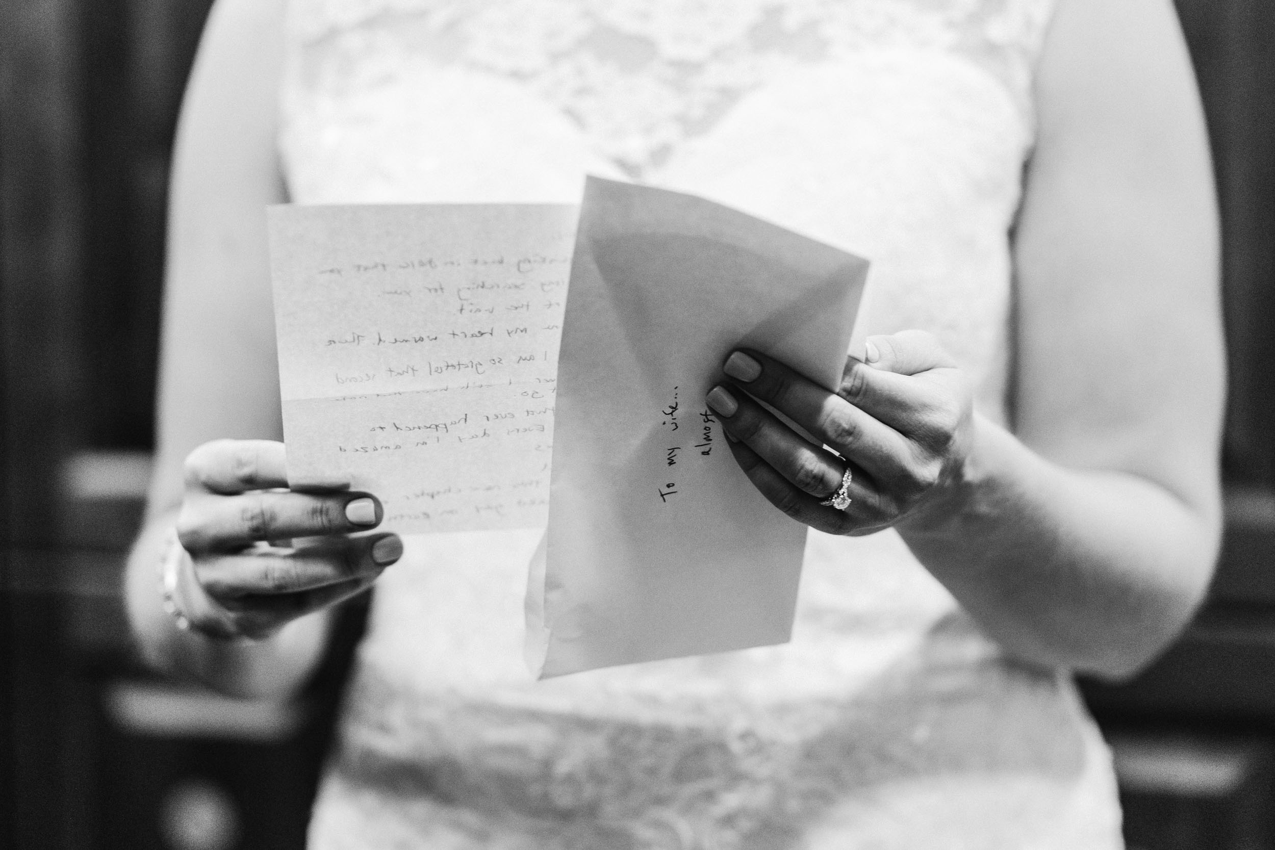 bride reading letter from groom by Shea McGrath Photography Denver Colorado Wedding Photographer