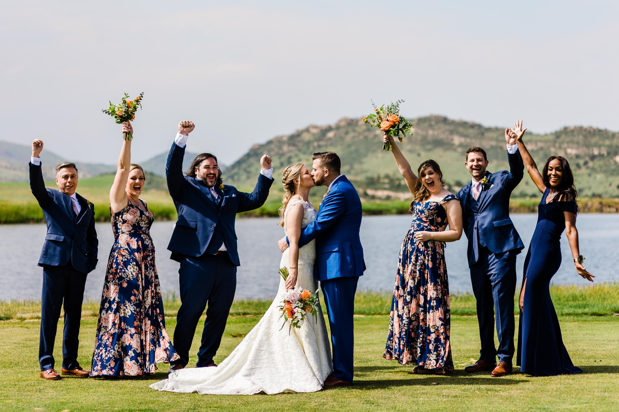 wedding party cheering while couple kisses by Shea McGrath Photography Denver Colorado Wedding Photographer