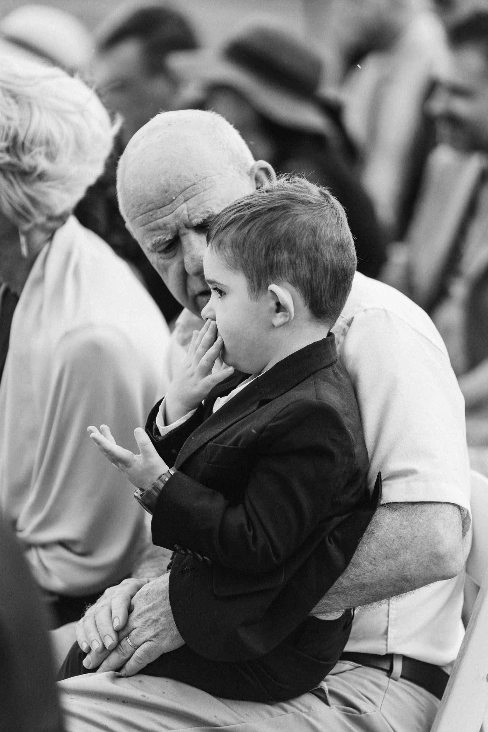 little boy doing sign language at wedding ceremony by Shea McGrath Photography Denver Colorado Wedding Photographer