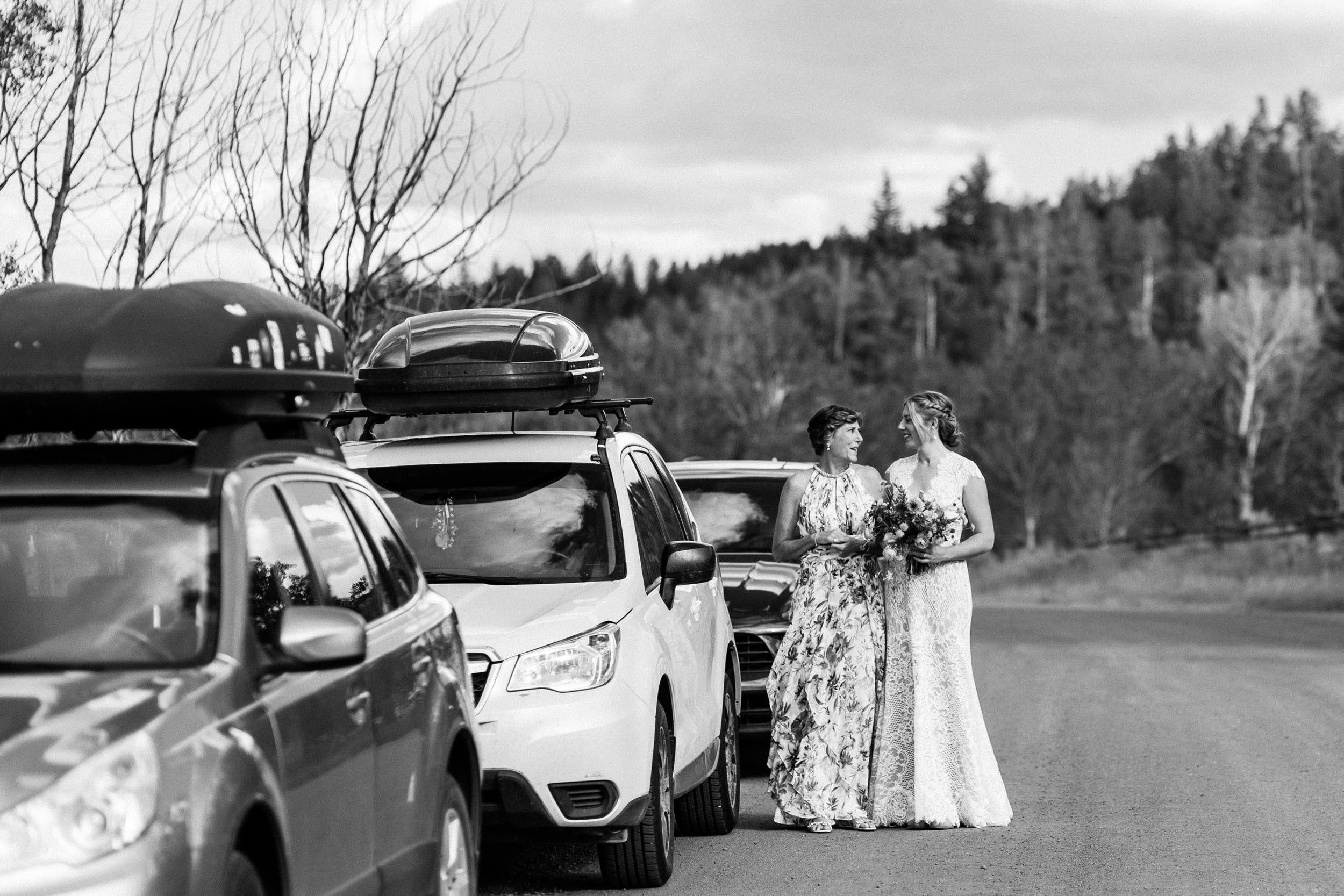 Bride and mom walking to ceremony in Steamboat Springs by Shea McGrath Photography Colorado Wedding Photographer