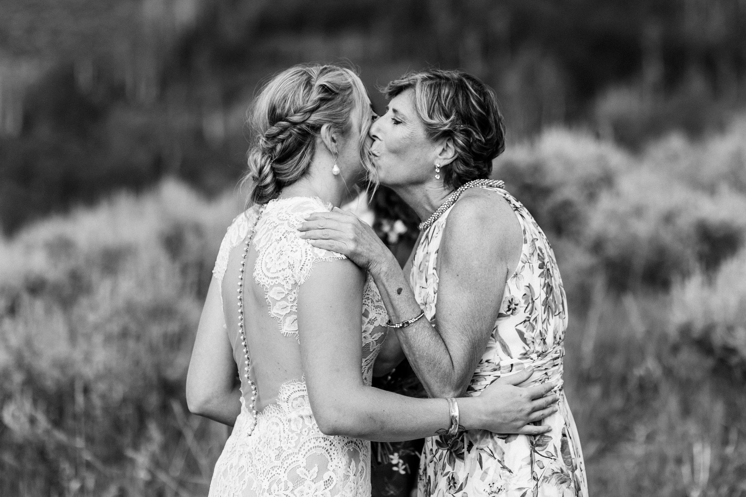 Mom and bride kissing before ceremony by Shea McGrath Photography Colorado Wedding Photographer