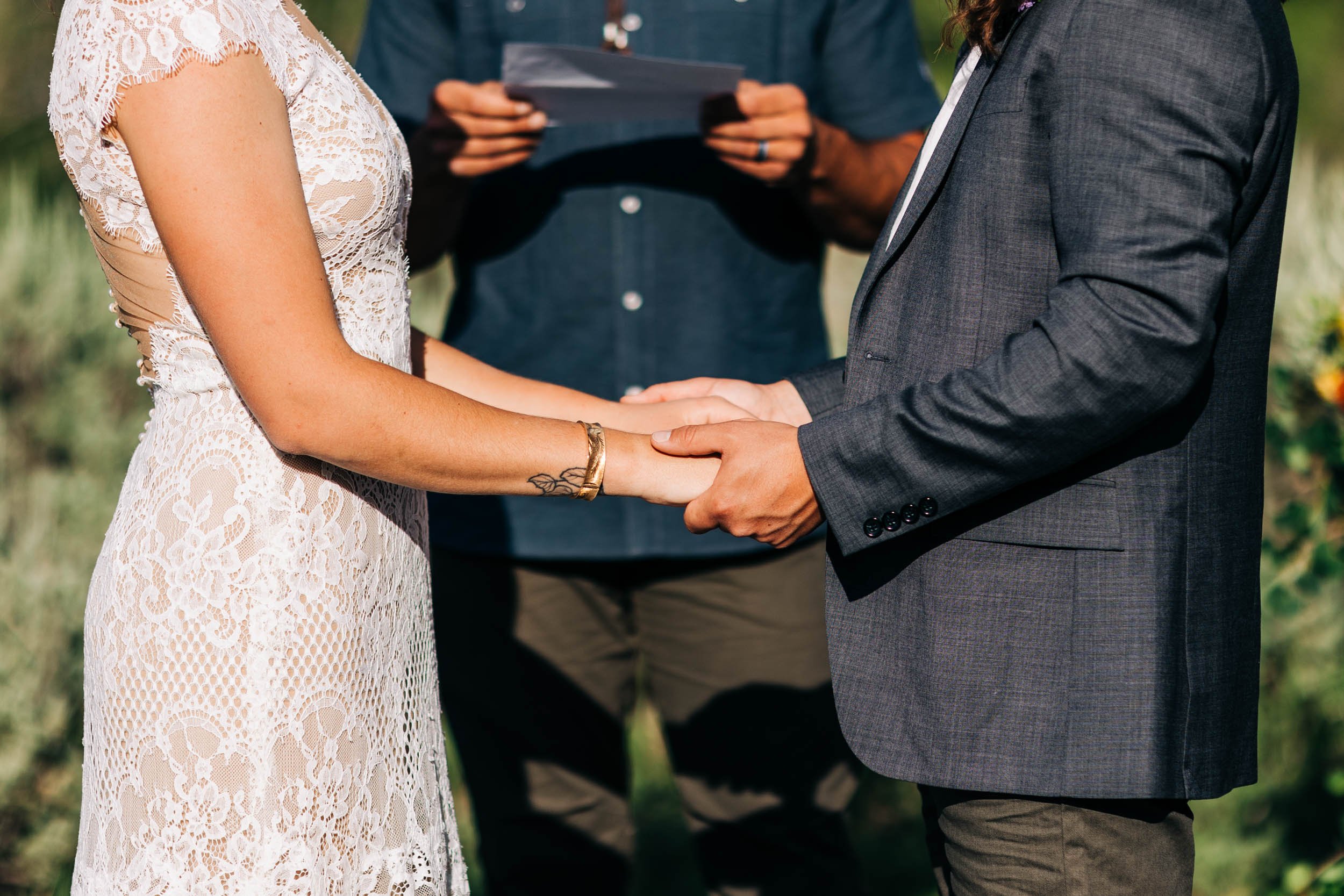holding hands at ceremony