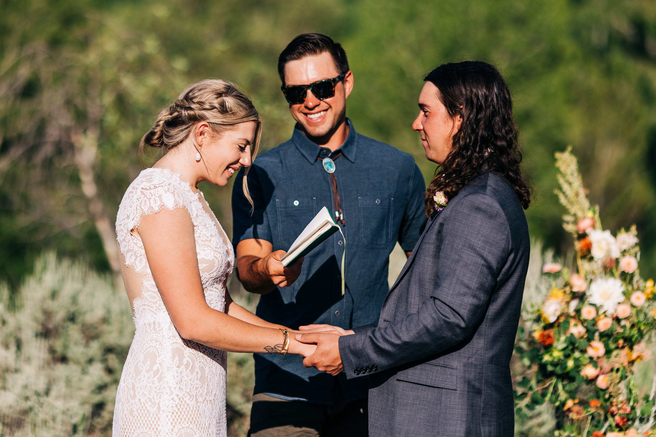 Bride reading vows at wedding ceremony in Steamboat Springs Colorado