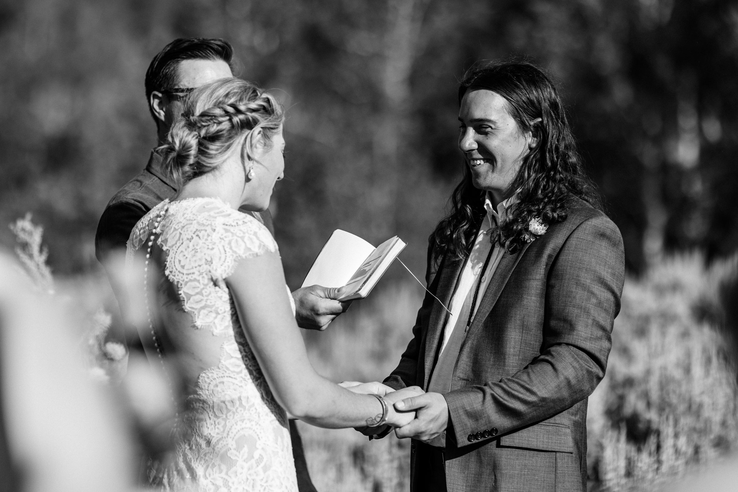 Bride reading vows at wedding ceremony in Steamboat Springs Colorado