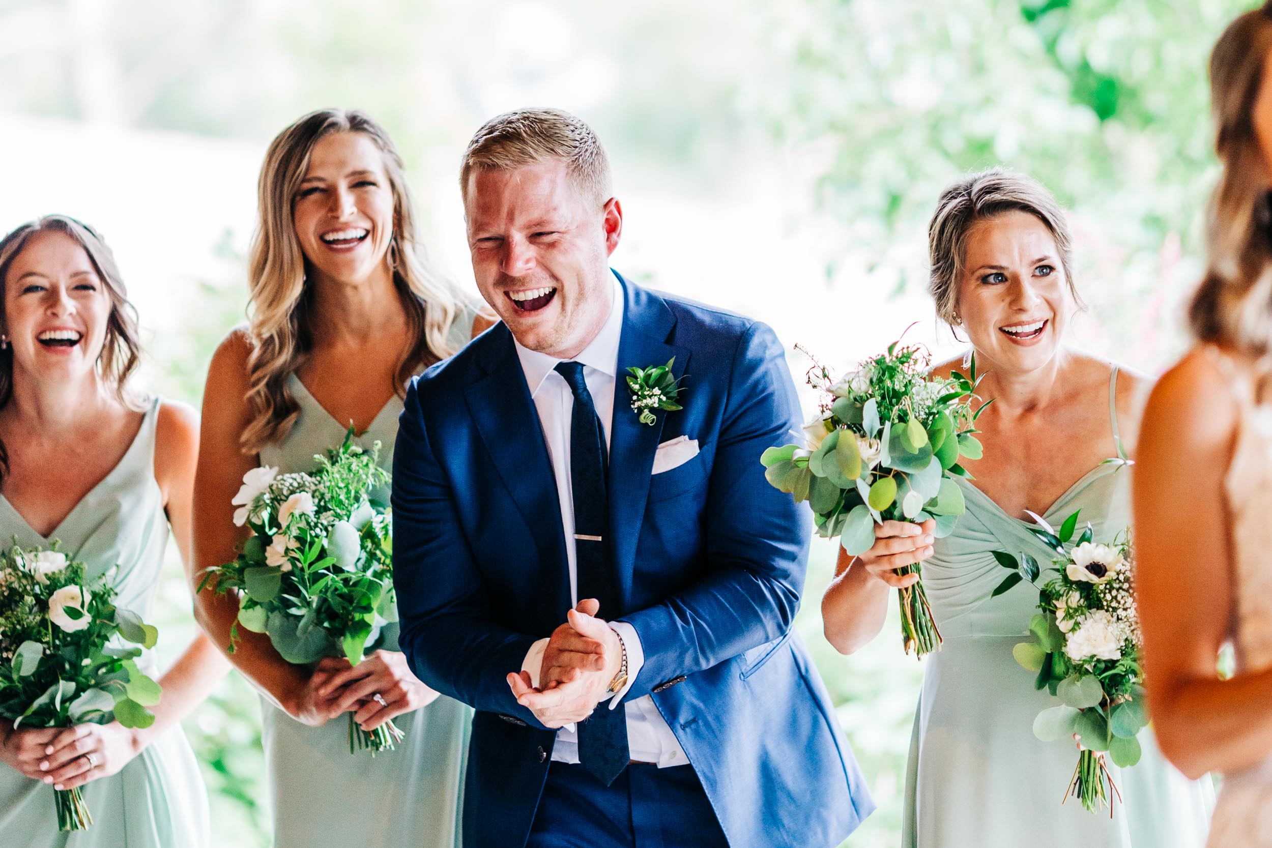 wedding party laughing during ceremony