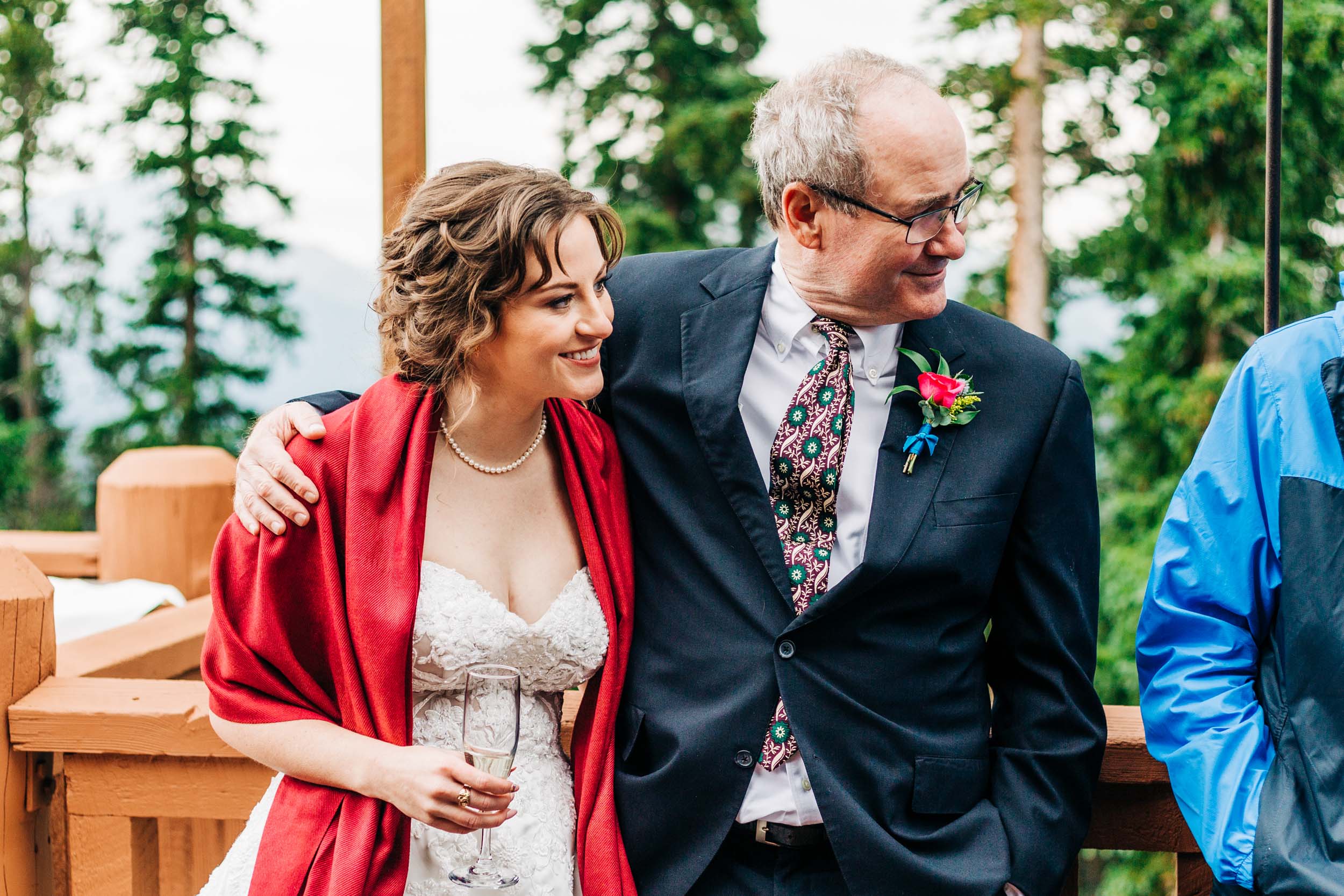 Dad with arm around bride at cocktail hour at wedding