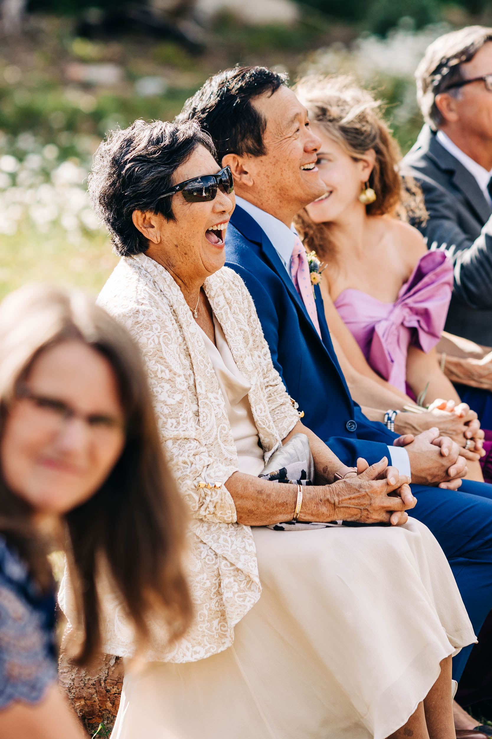 Grandma laughing at wedding ceremony