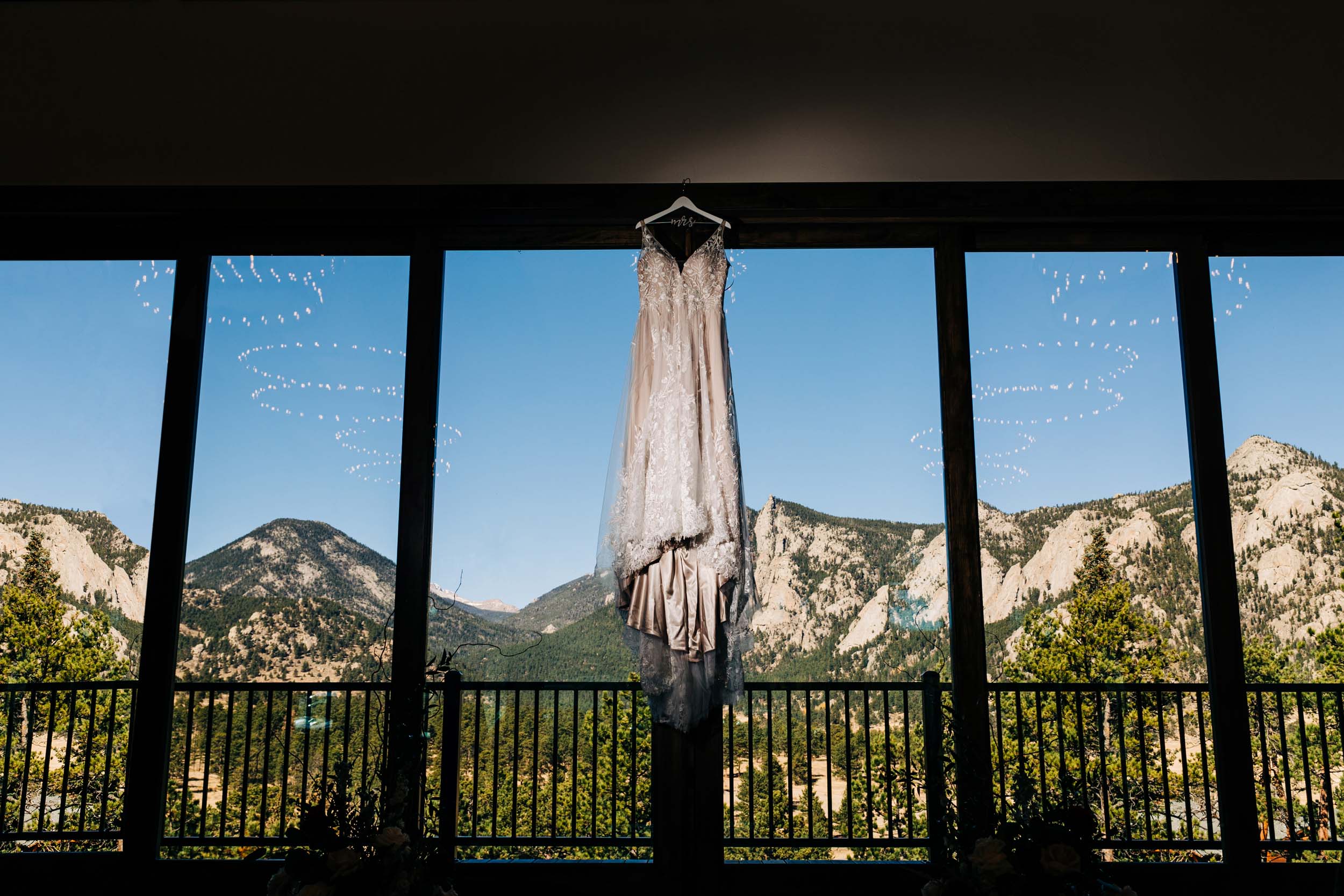 wedding dress hanging in window at black canyon inn