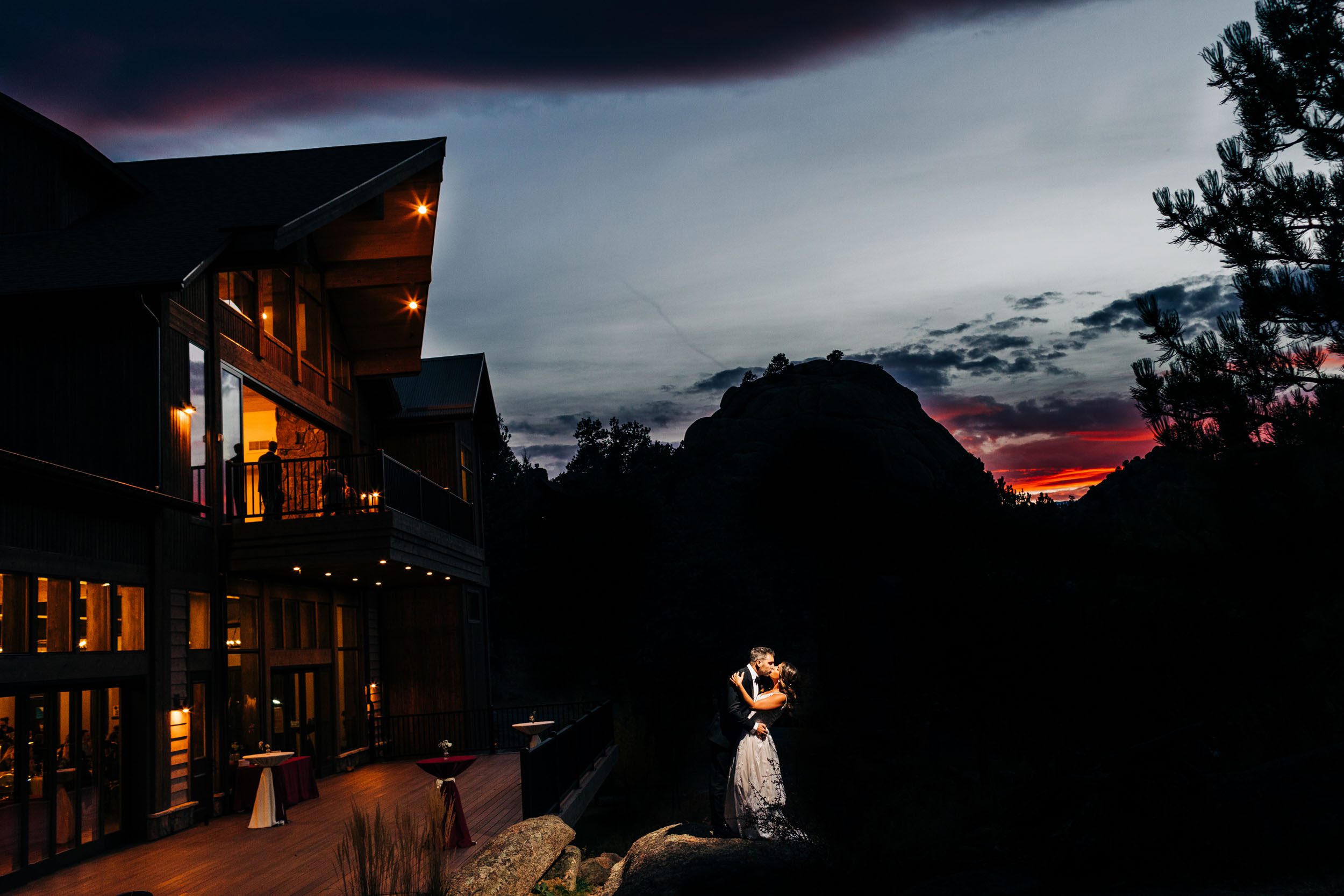 picture of the wedding couple at sunset at boulders black canyon inn in Estes park