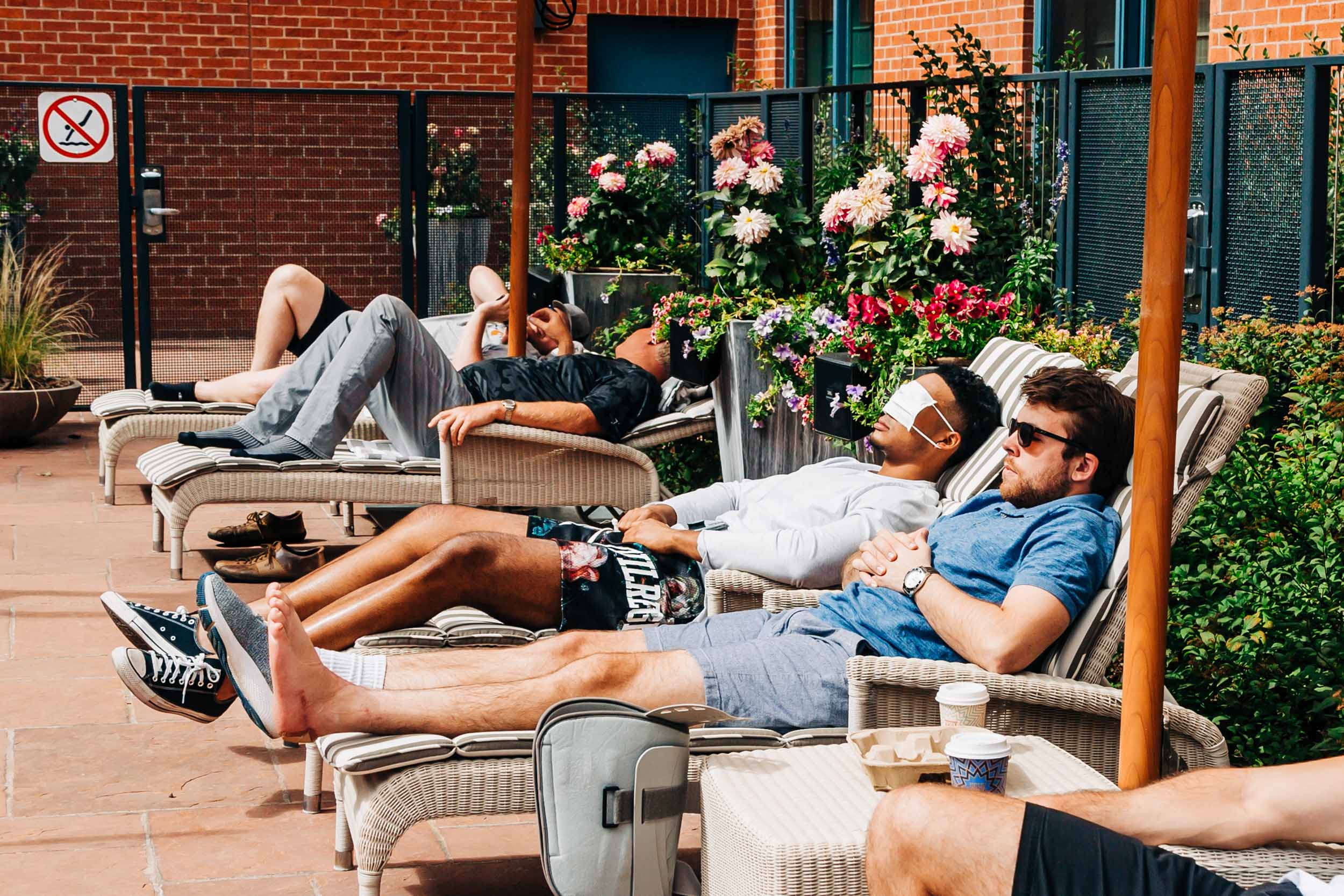 groomsmen hanging out by the pool before wedding