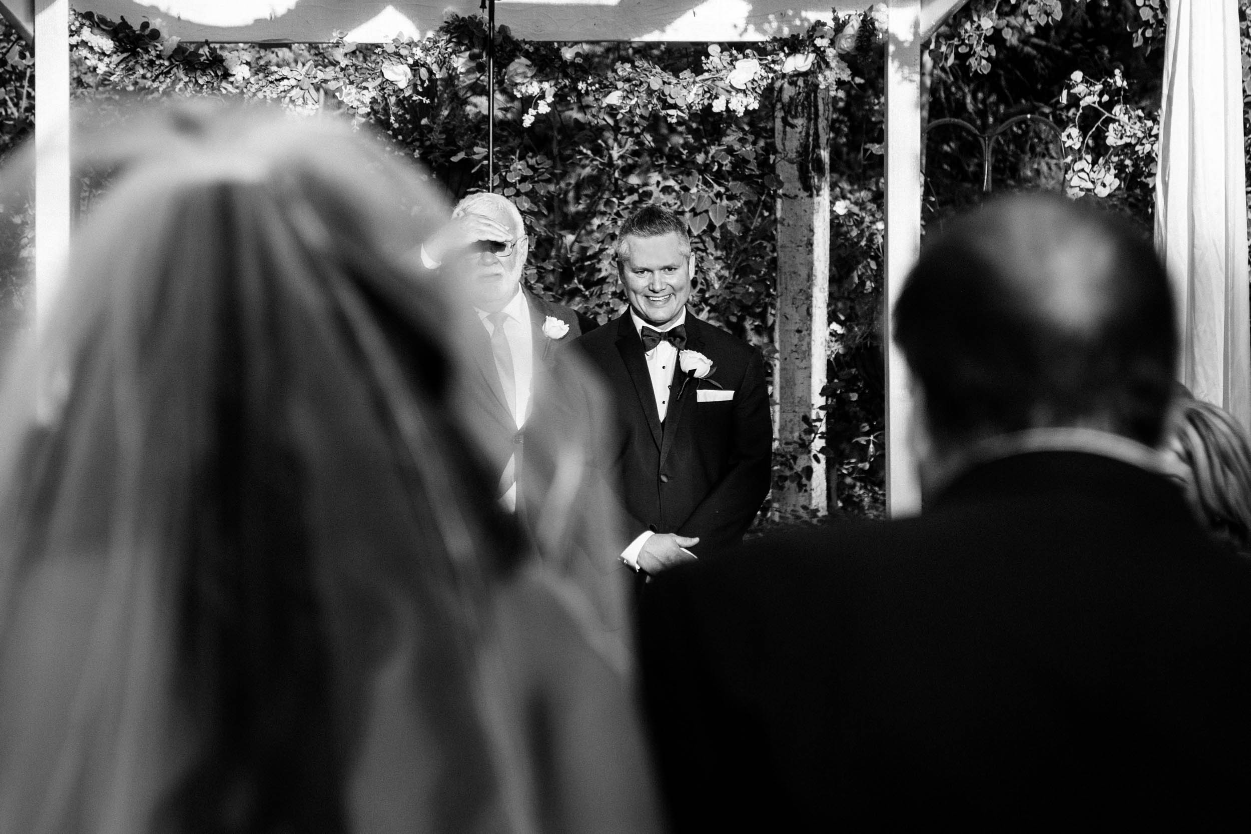 grooms reaction to bride walking down aisle