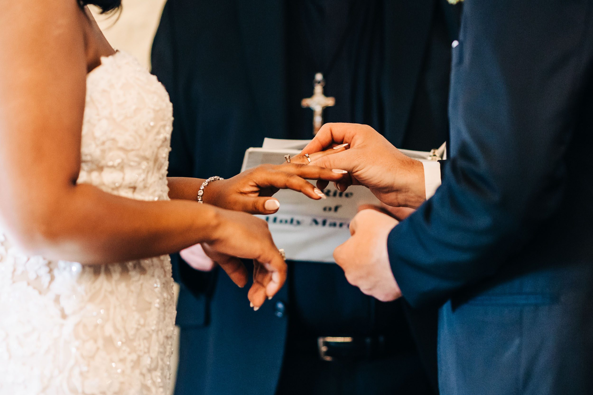 picture of couple exchanging rings at wedding