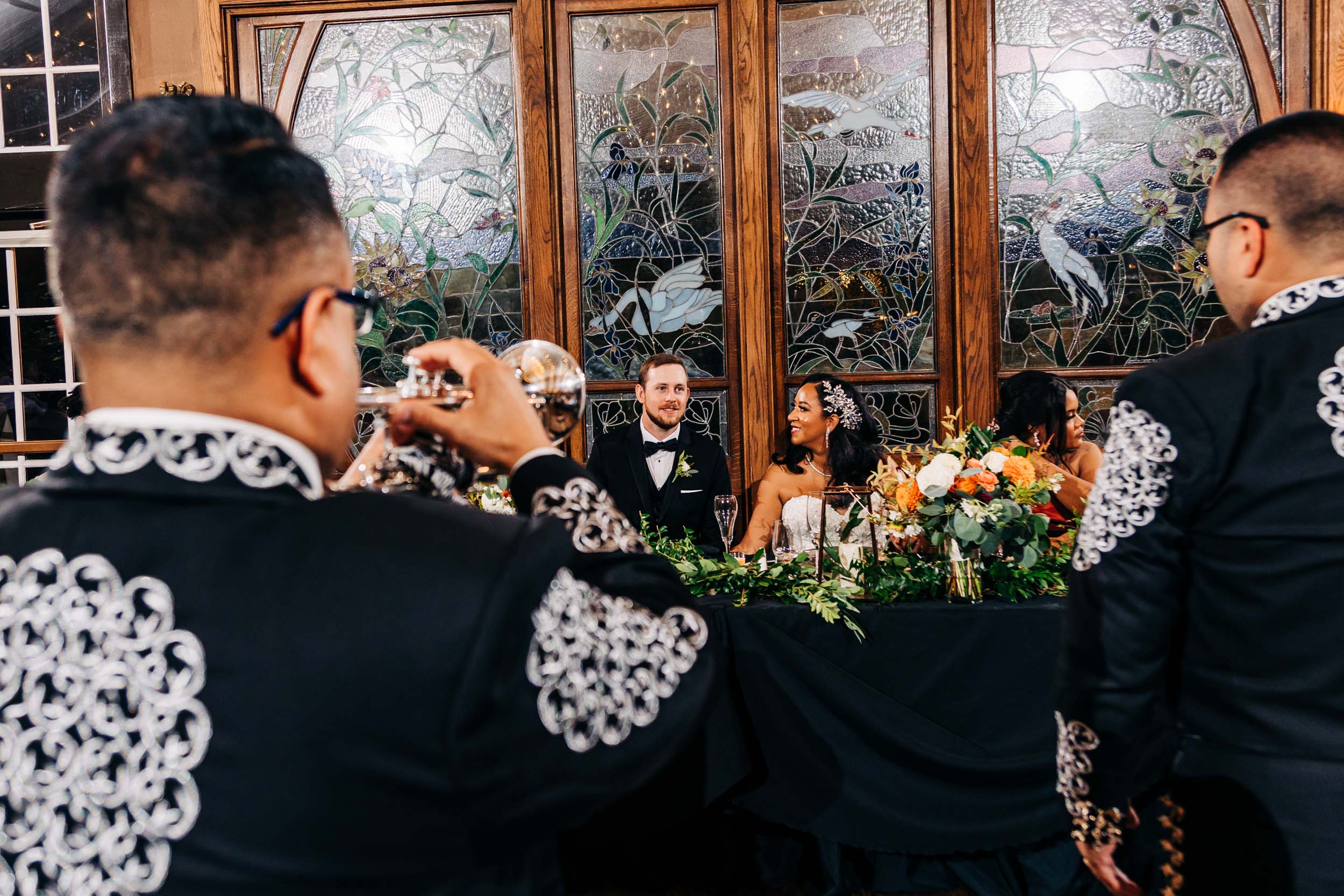 mariachi band playing for wedding couple at wedding reception