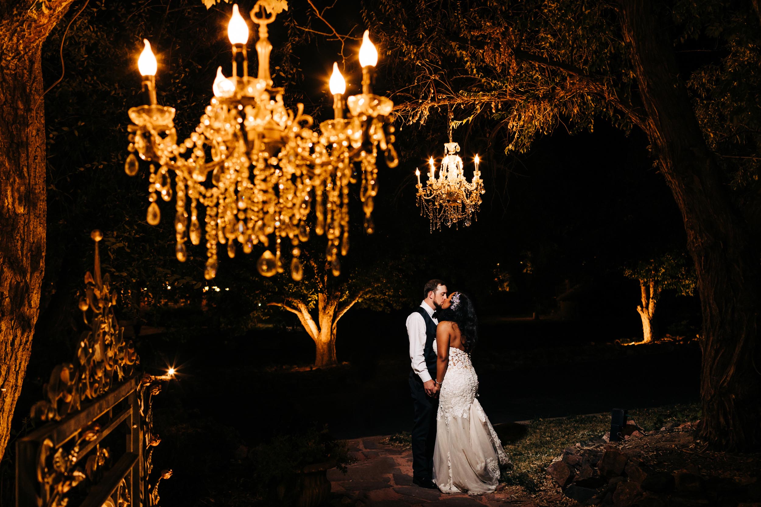 lionsgate event center wedding portrait of couple at night outside by the chandeliers