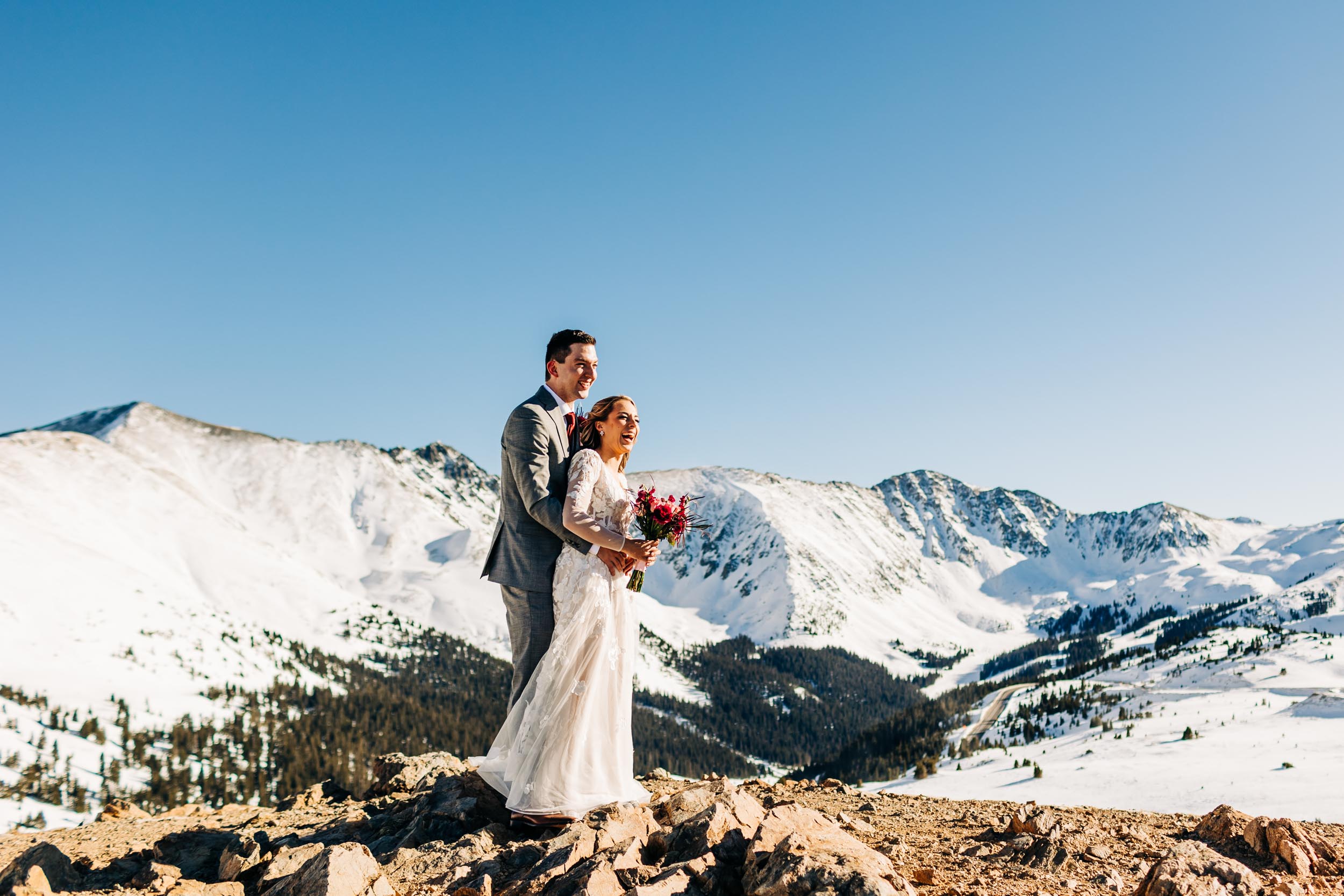 wedding photo taken at the top of loveland pass in colorado
