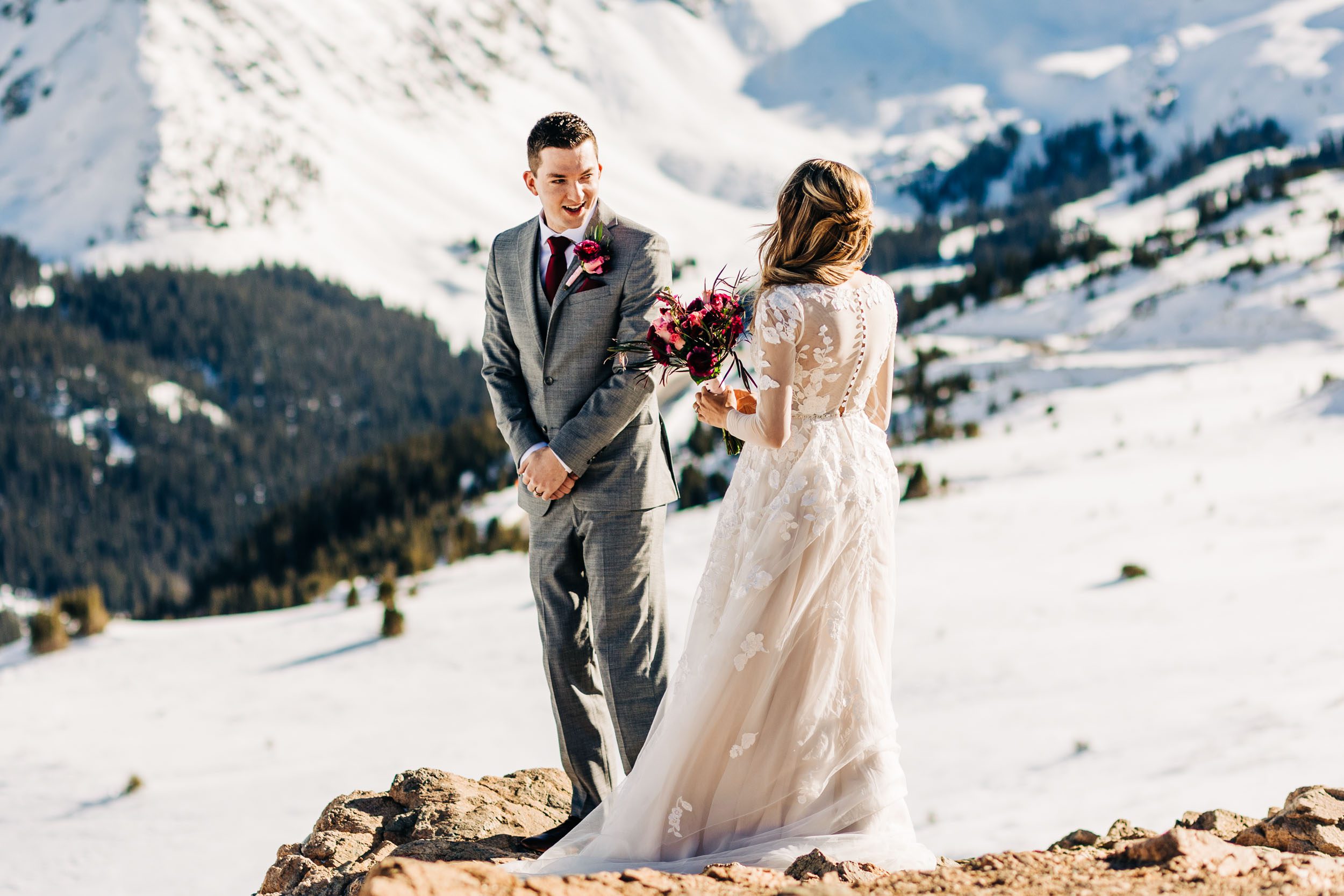 photo of wedding couple's first look at loveland pass