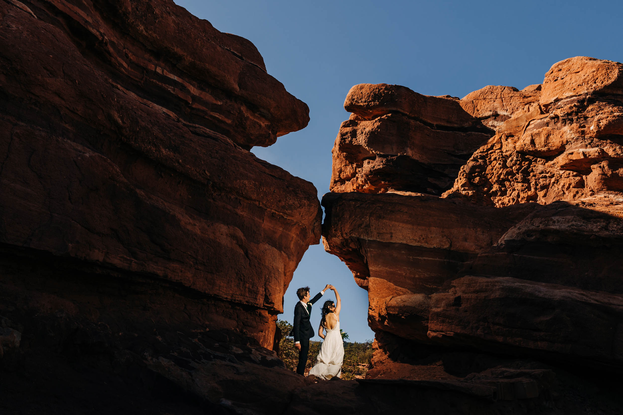 Couple dancing under arch at Garden of the Gods