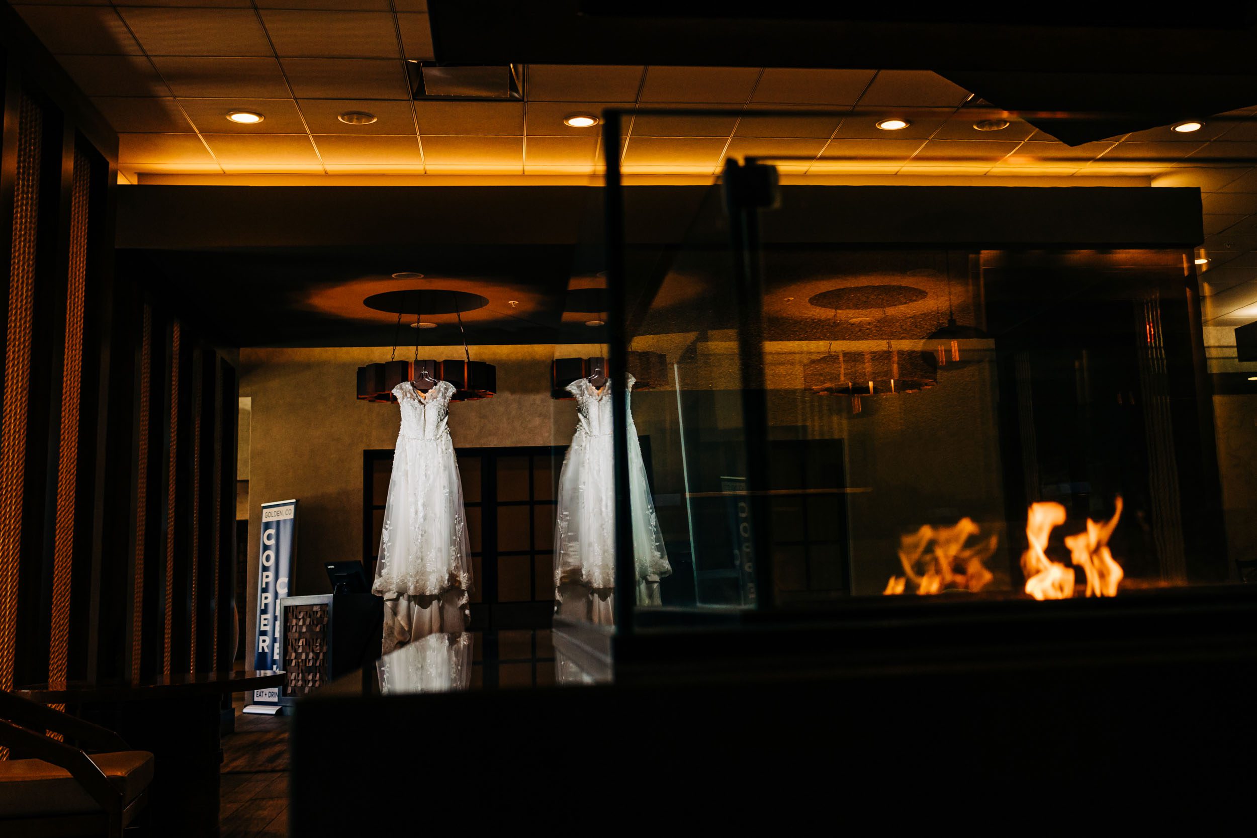 wedding dress hanging in hotel lobby