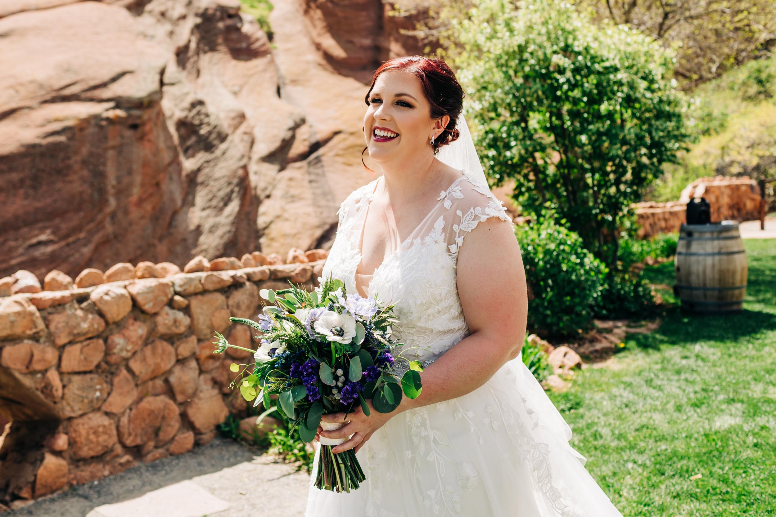 bride walking down the aisle at red rocks trading post wedding