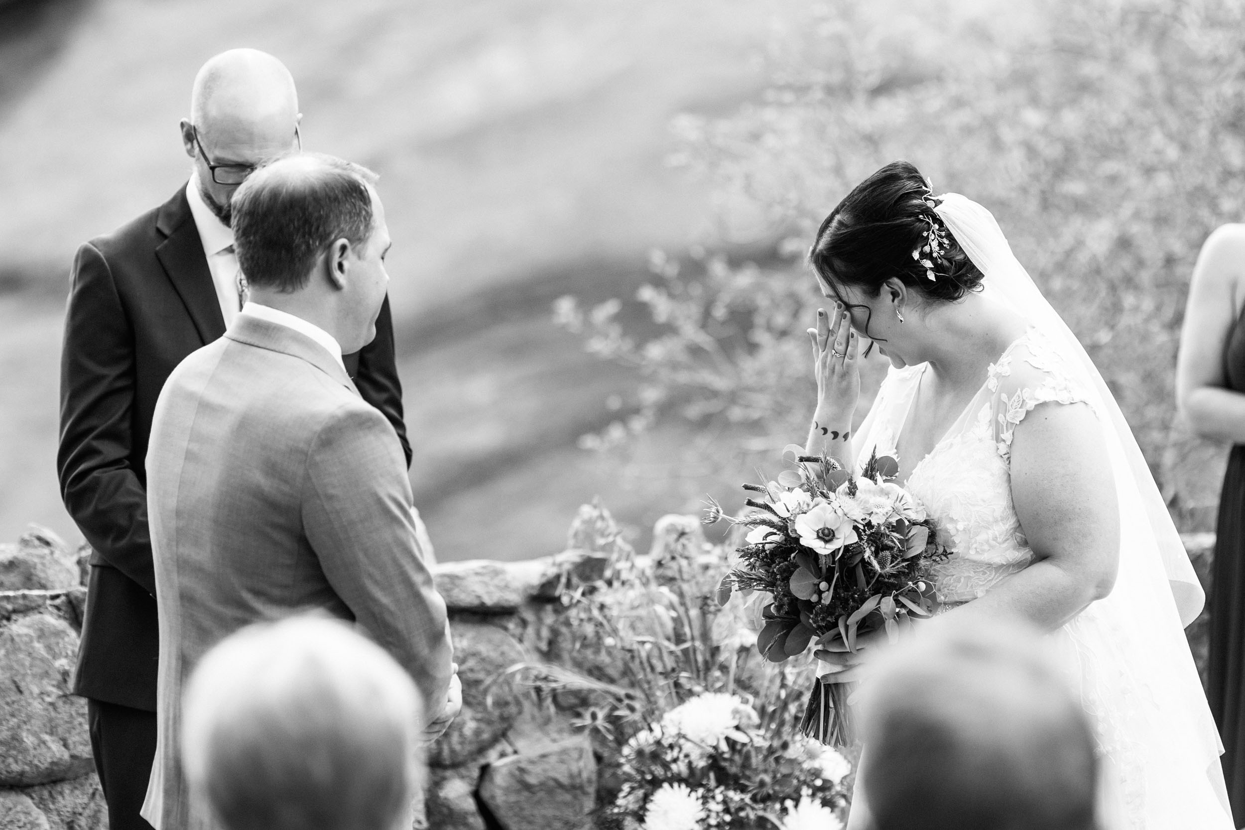 bride crying at red rocks trading post wedding ceremony
