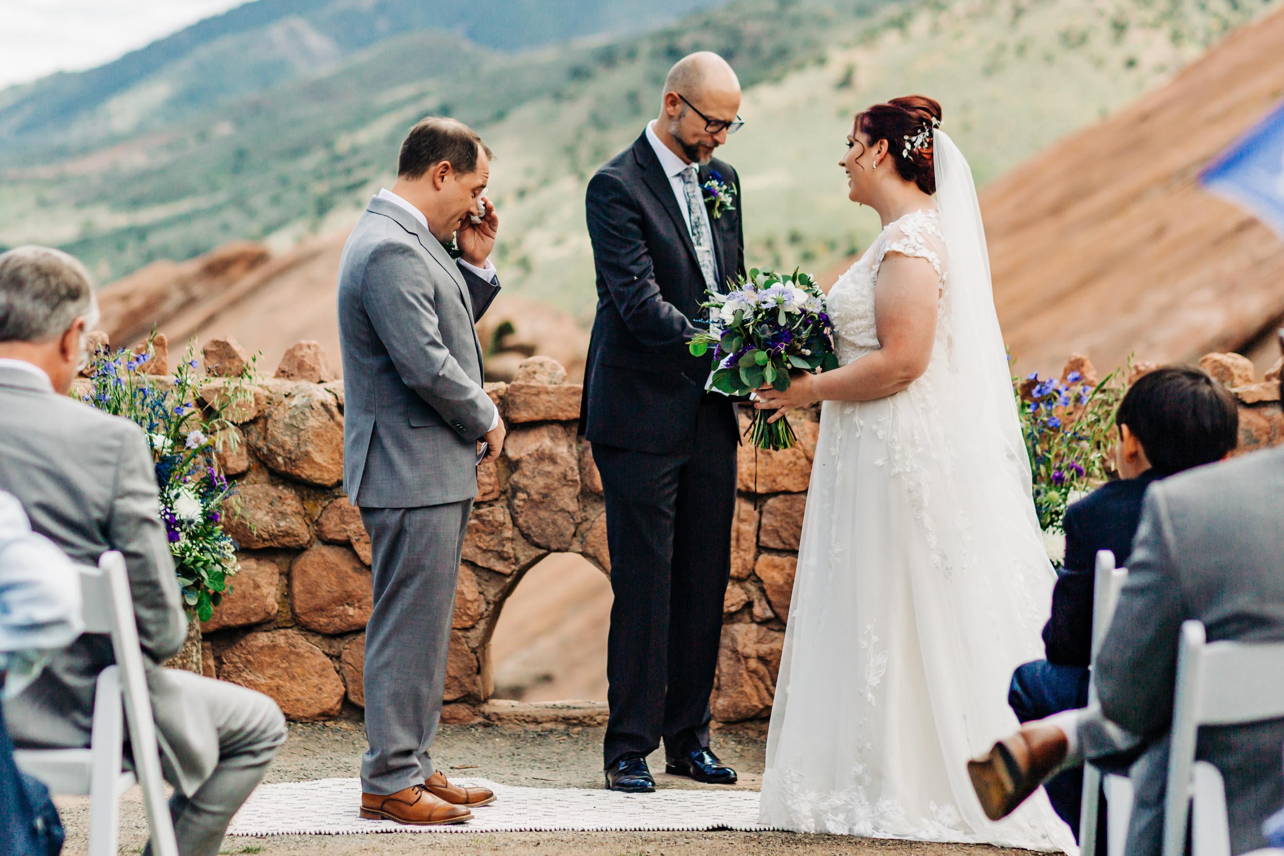 groom crying at red rocks trading post wedding ceremony