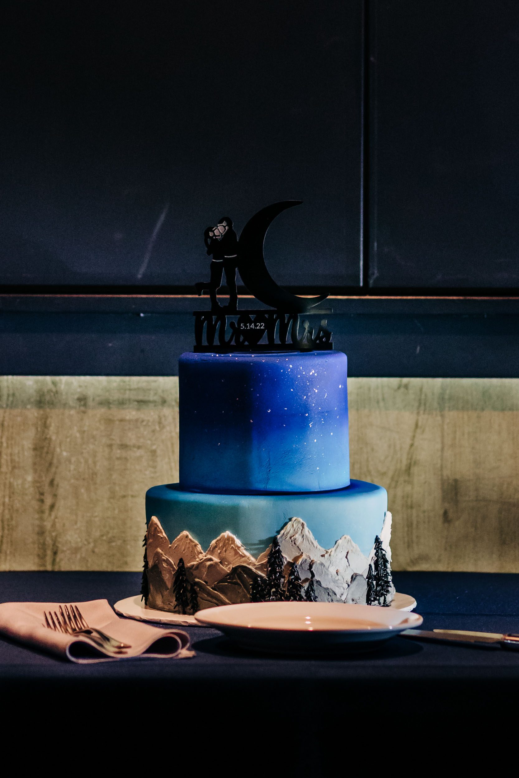 blue wedding cake with mountains