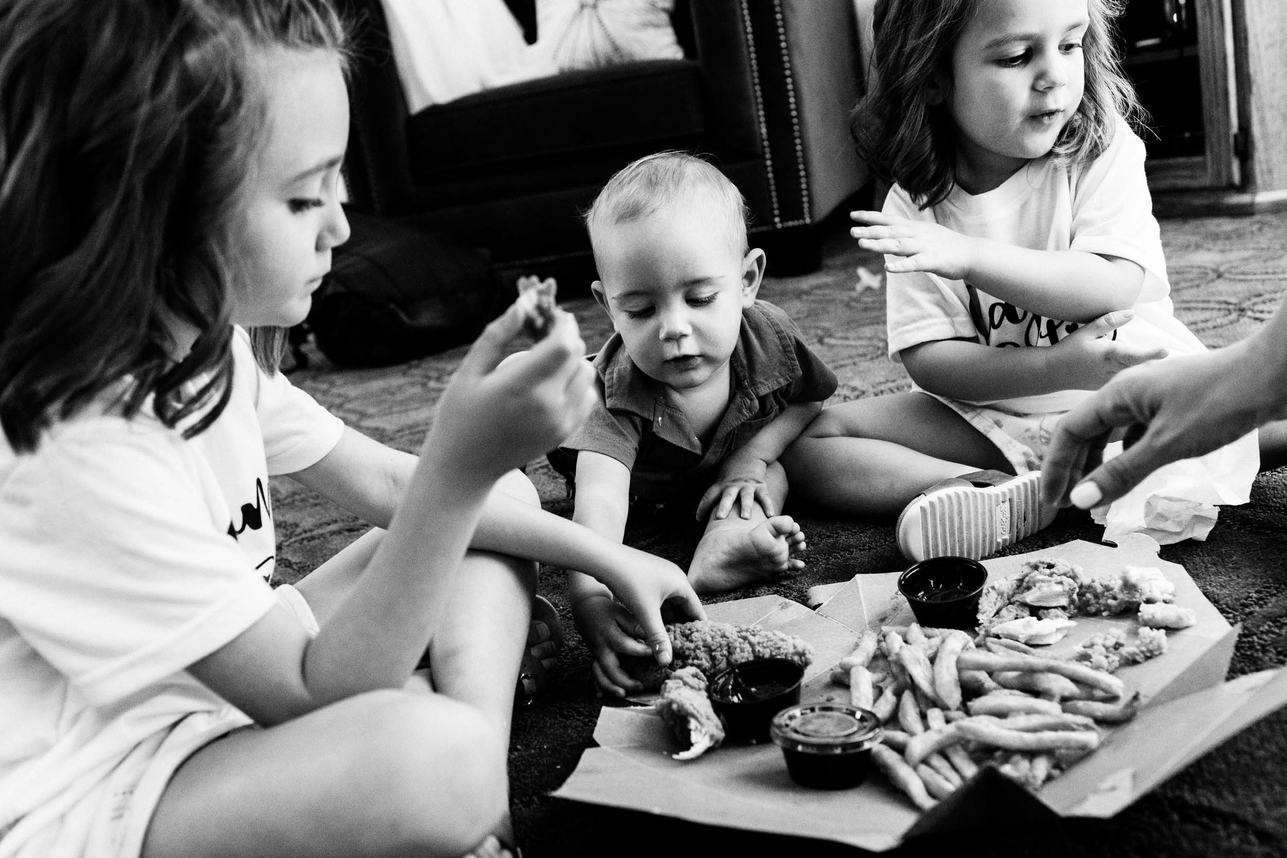 candid photo of kids eating before wedding