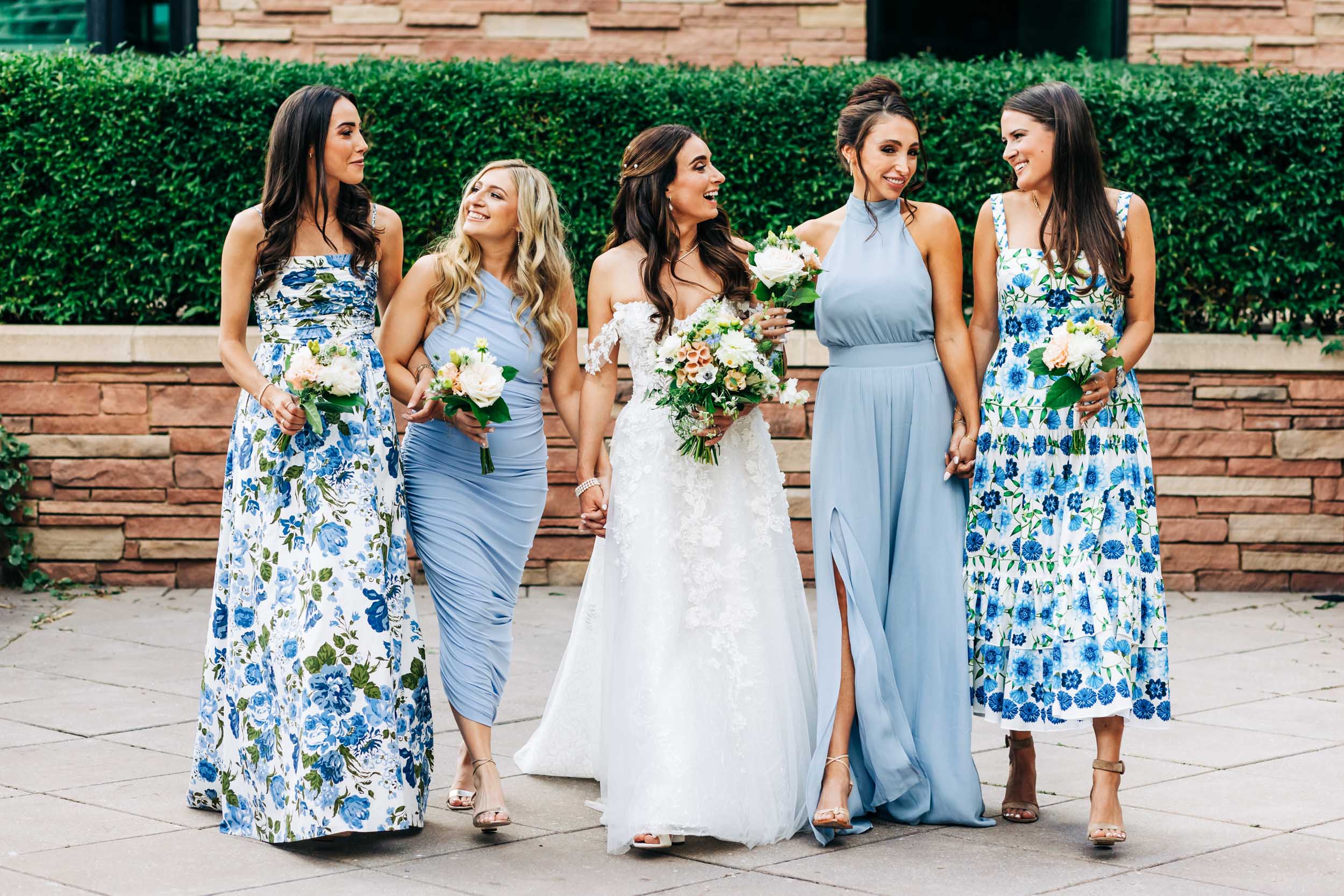 Bridesmaids in courtyard of St Julien hotel and spa