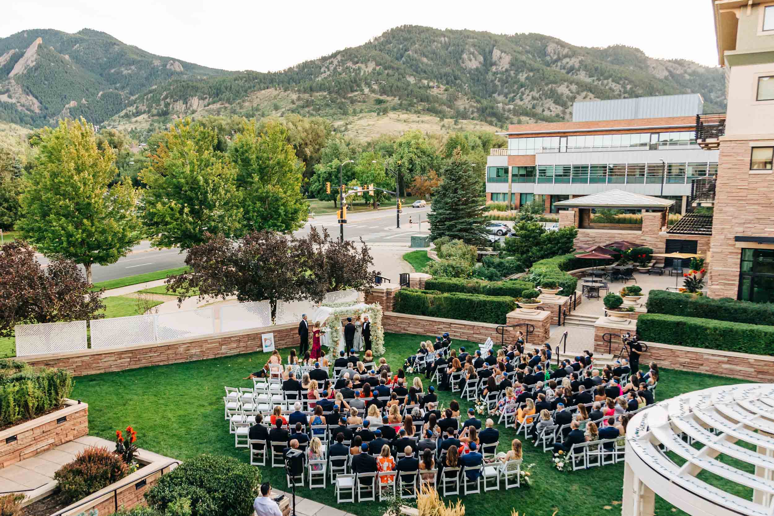Wide photo of St Julien hotel wedding ceremony on lawn