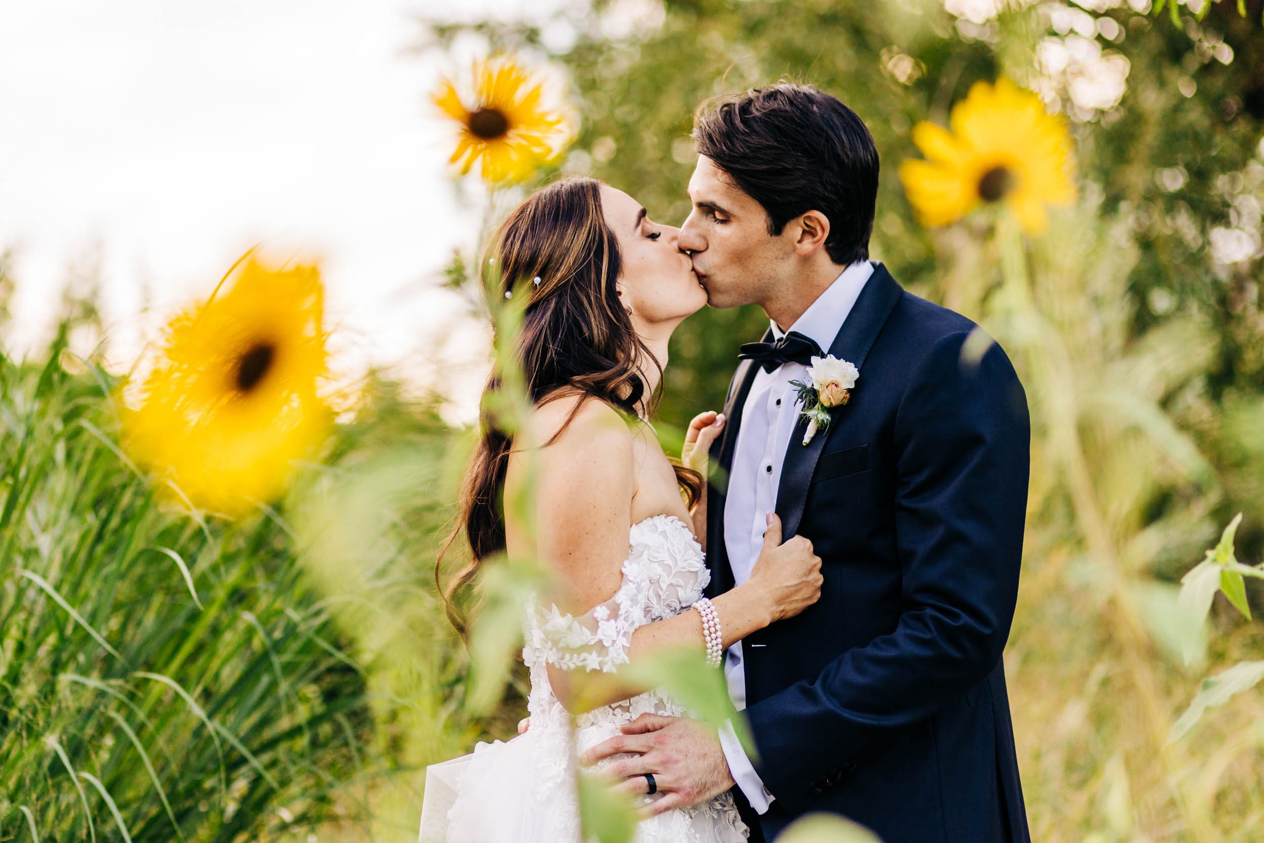 photo of wedding couple with sunflowers