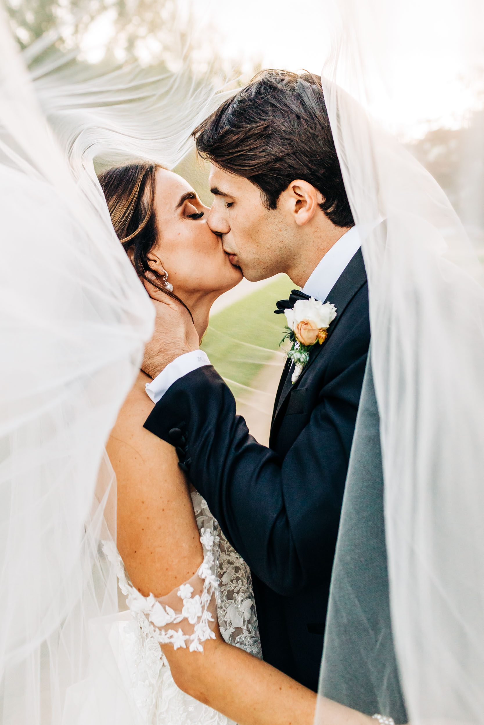 photo of wedding couple under veil