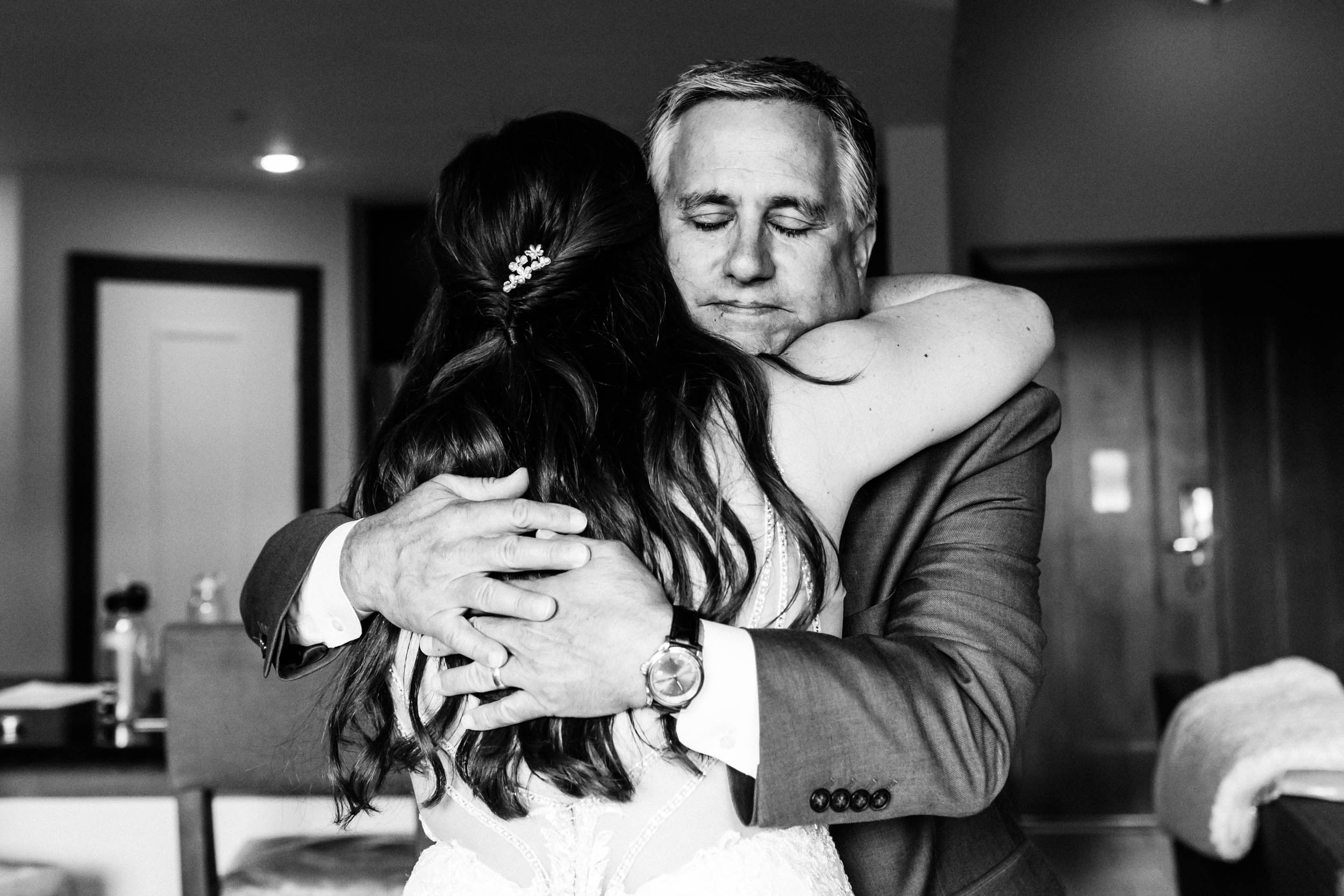 bride and dad hugging